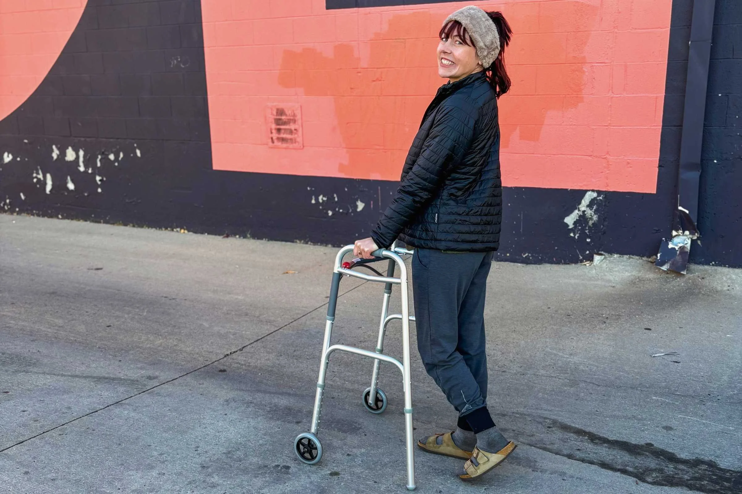 person walking with a walker wearing birkenstock arizona sandals