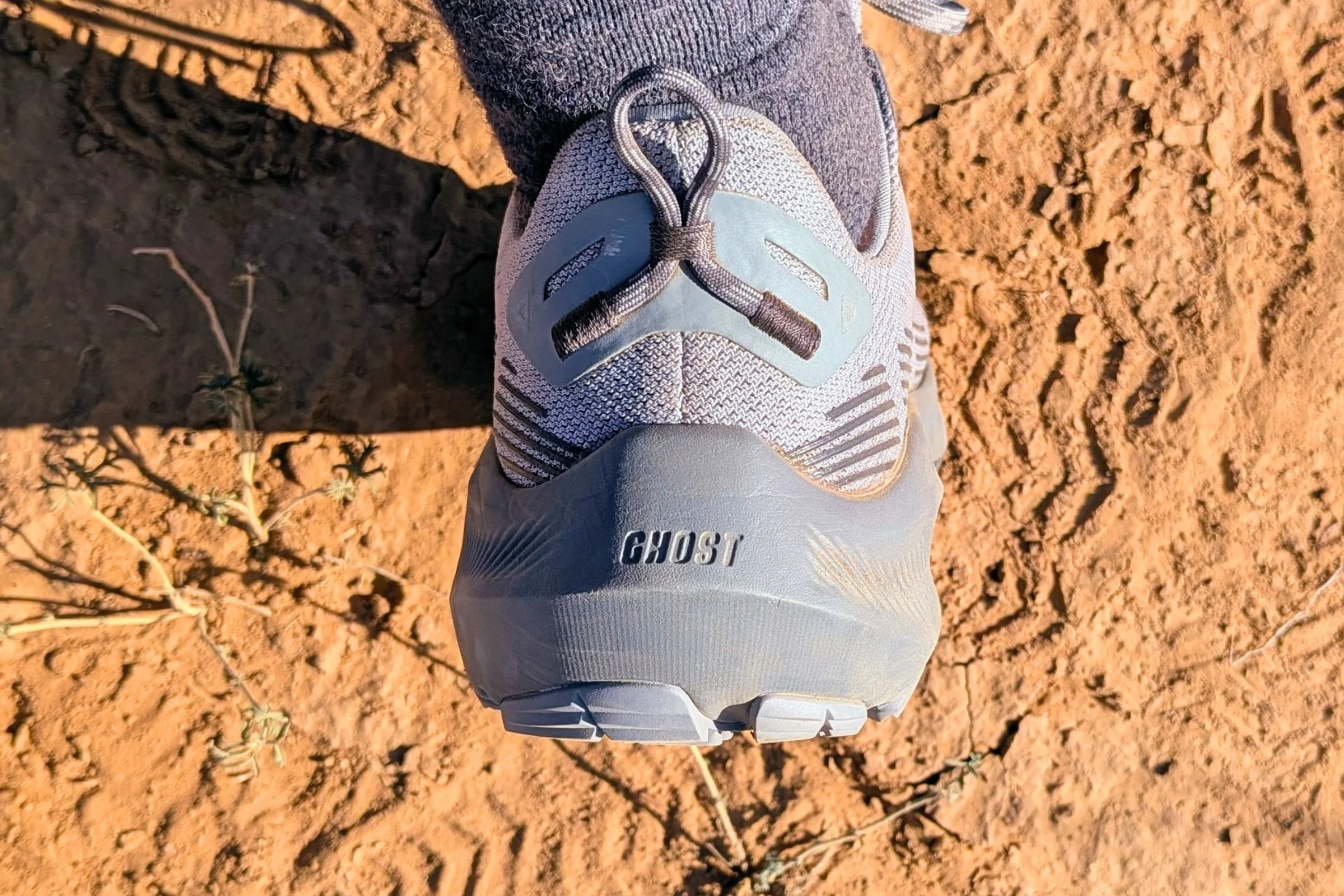 Close-up shot of Brooks Ghost trail running shoes from the back.