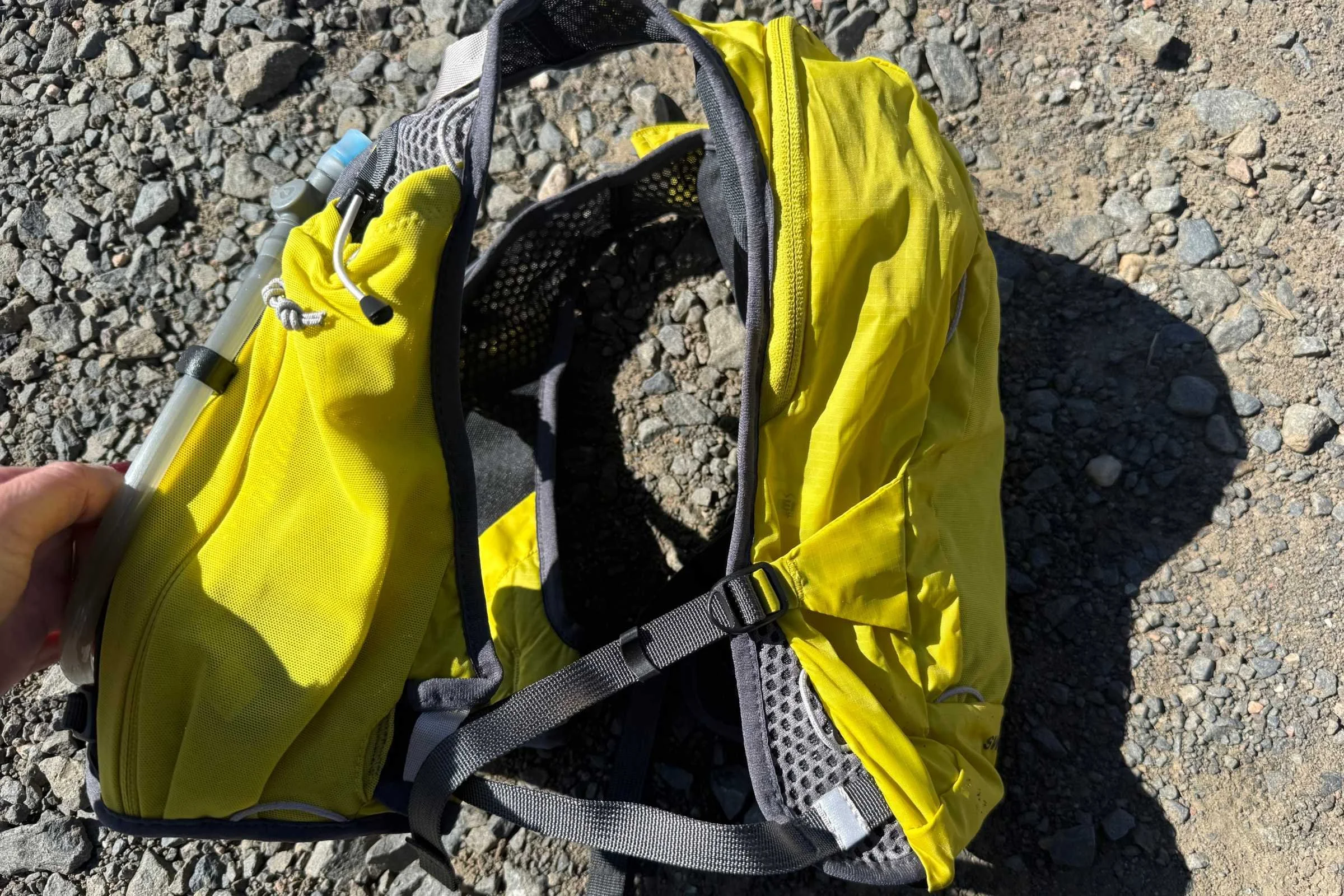 The shoulder straps and backpack section are connected with webbing.