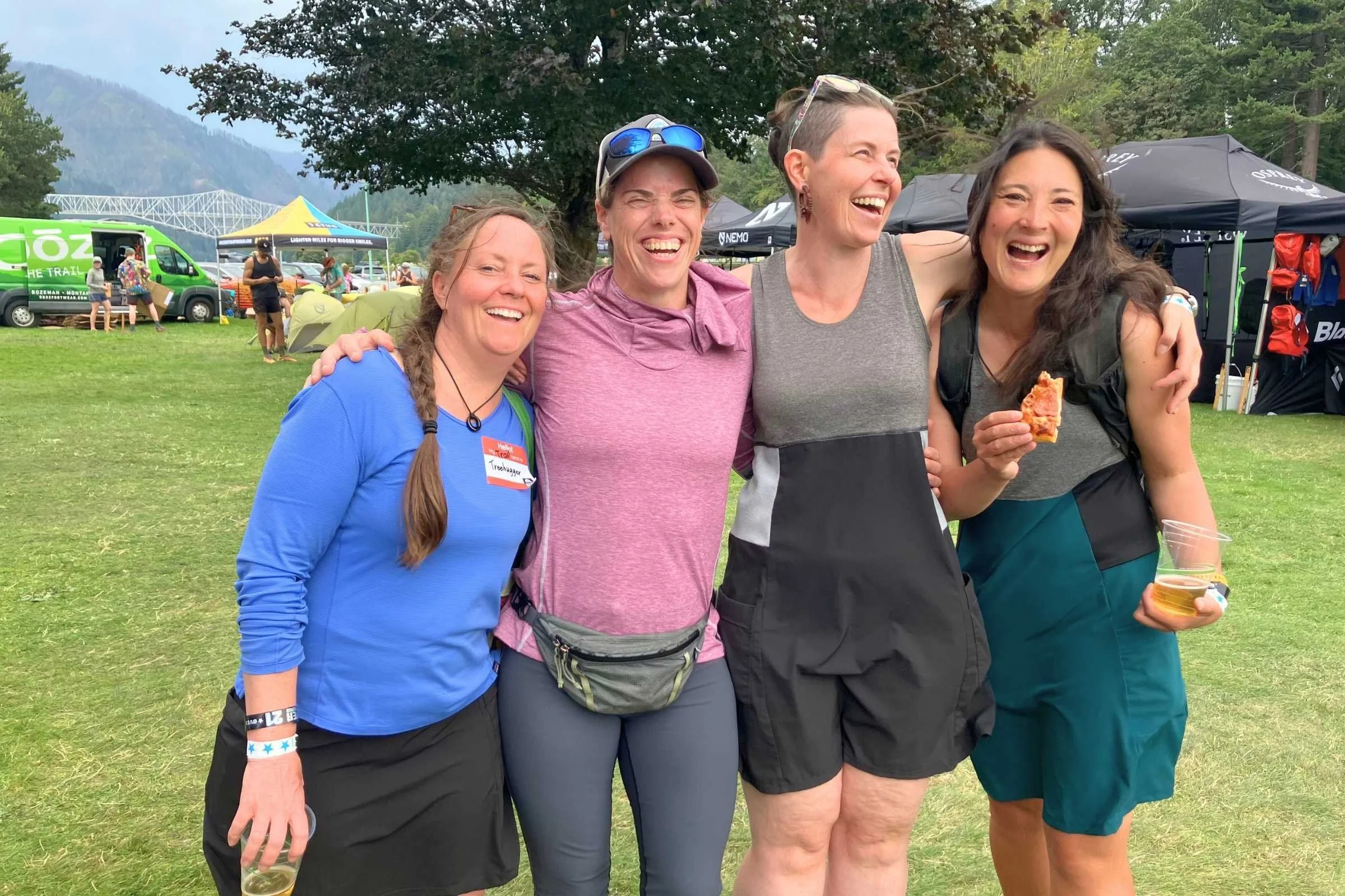 The Treeline Review team at the PCT Days Festival in Cascade Locks. Tiffany (third from left) and Liz (right) are wearing Purple Rain Adventure Dresses.