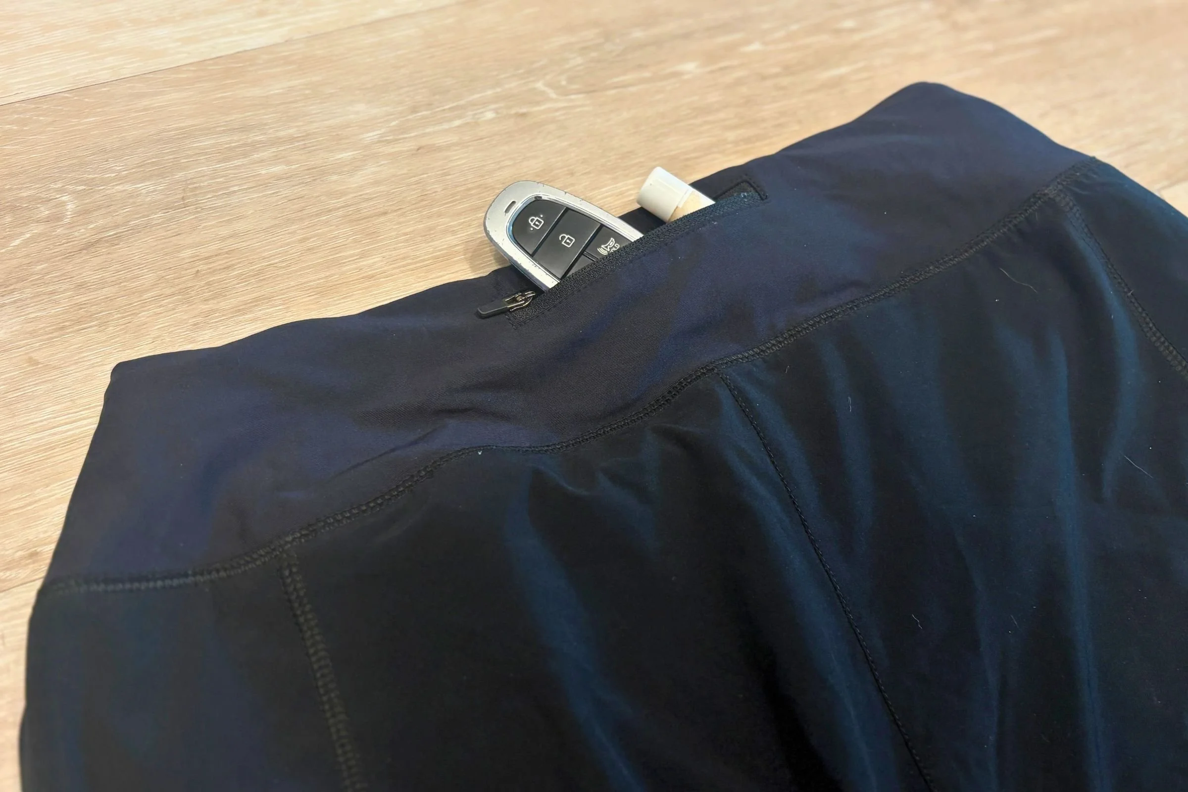 The Title Nine The Original Anti-Run Shorts have two handwarmer pockets on the front and a small zippered pocket on the back waistband.