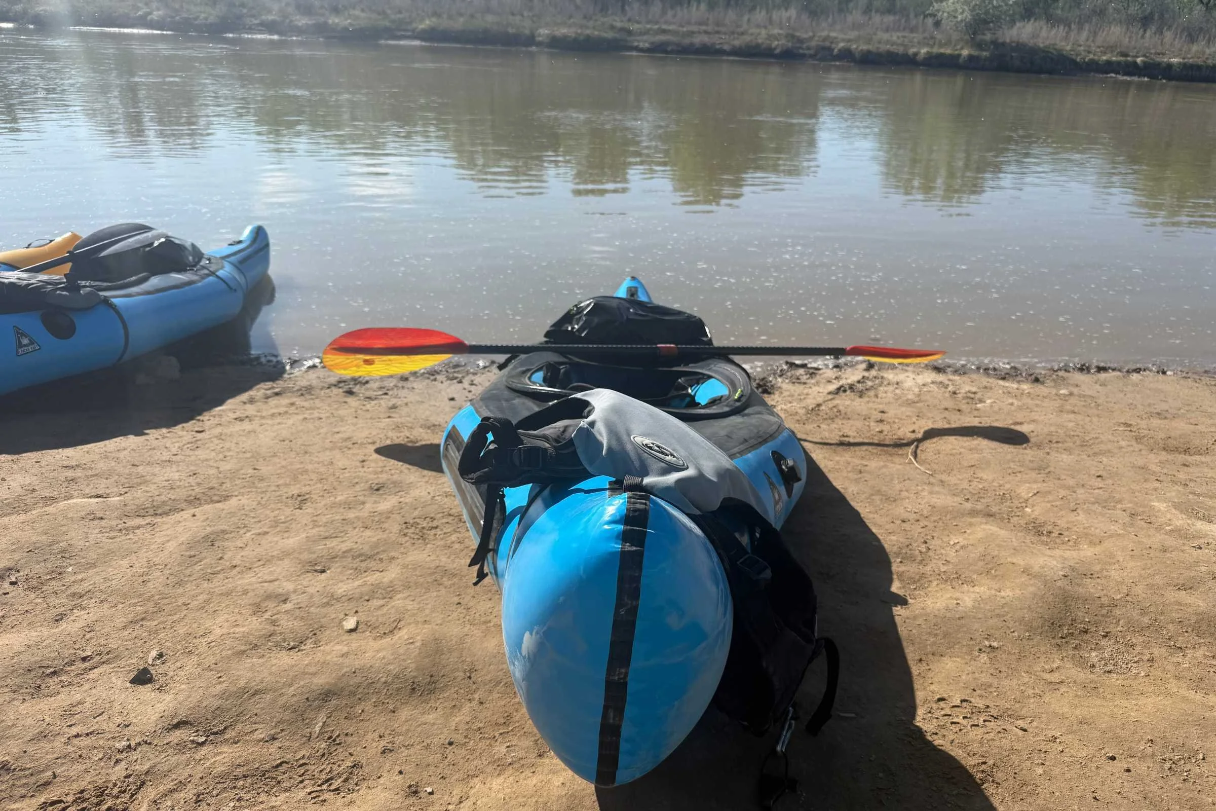 An Alpacka Raft Chinook on the beach