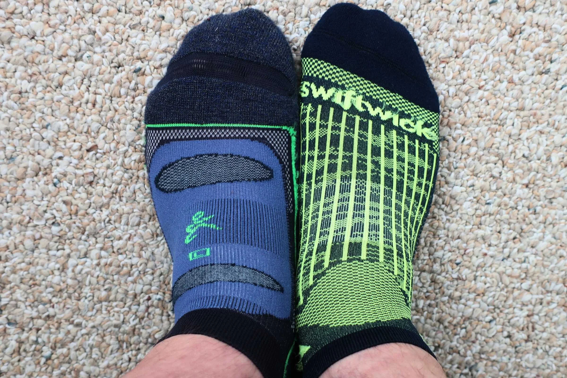 The Balega Blister Resist (left) and Swiftwick Zero on the right. Both running socks are winners in our guide. Which sock will serve you better on runs depends on where you are running, the climate, season, and your feet.