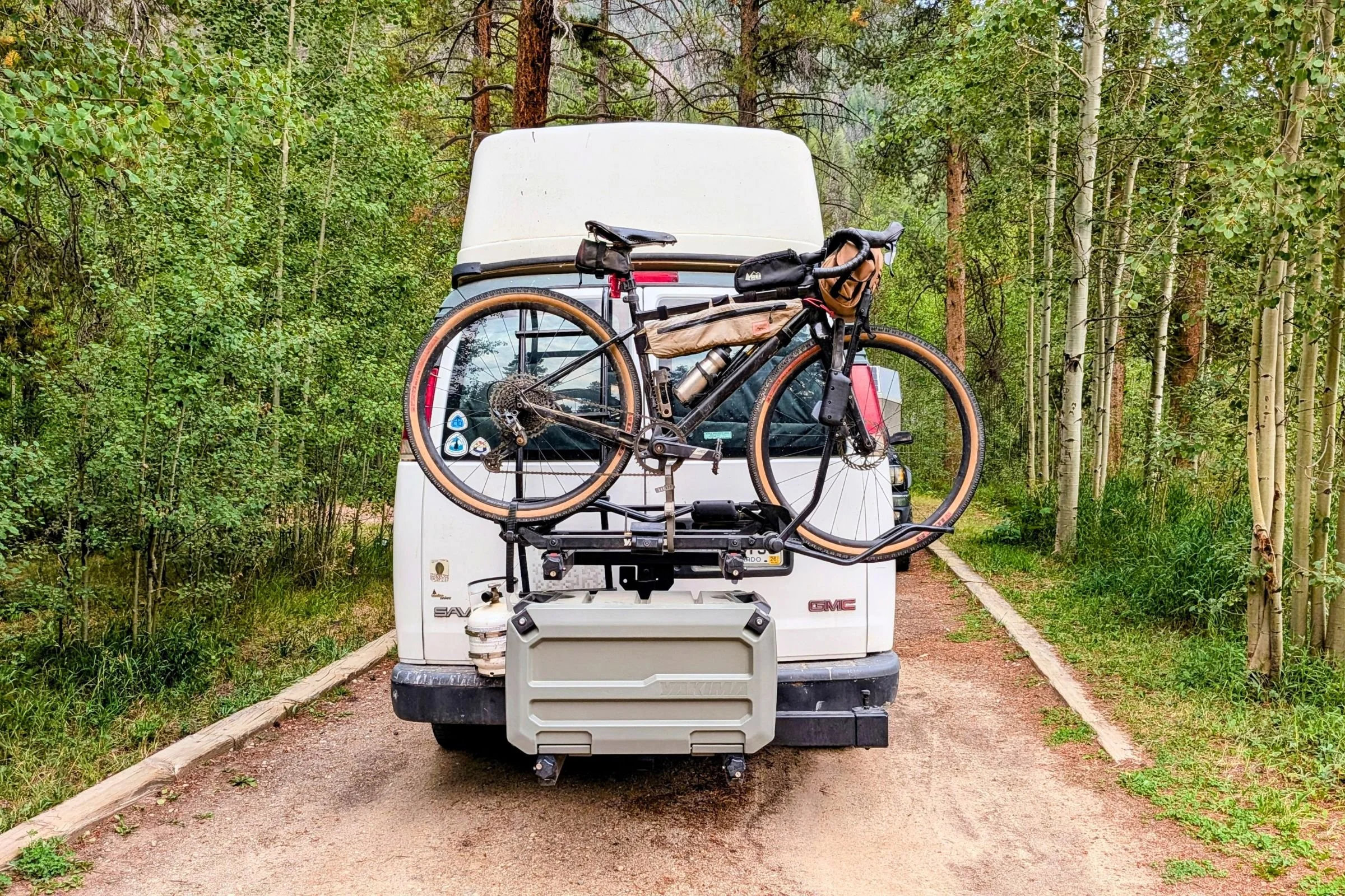 Yakima EXO OpenRange mounted on a van with a double bike rack attached to the EXO topshelf.