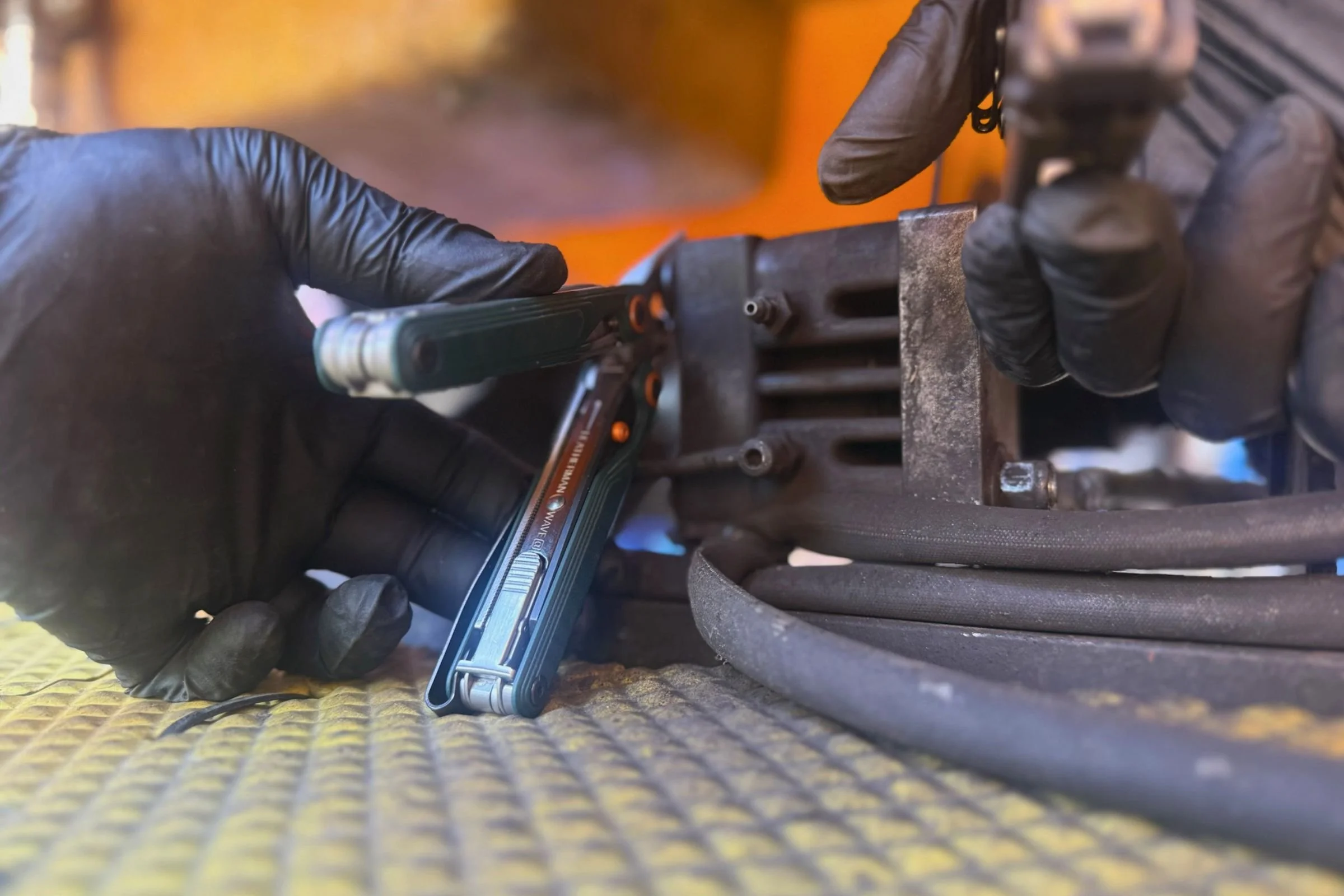 The comfortable handles on the Leatherman Wave Alpha made it easy to break apart an old hydraulic brake on a tricycle. Courtesy Chris Meehan