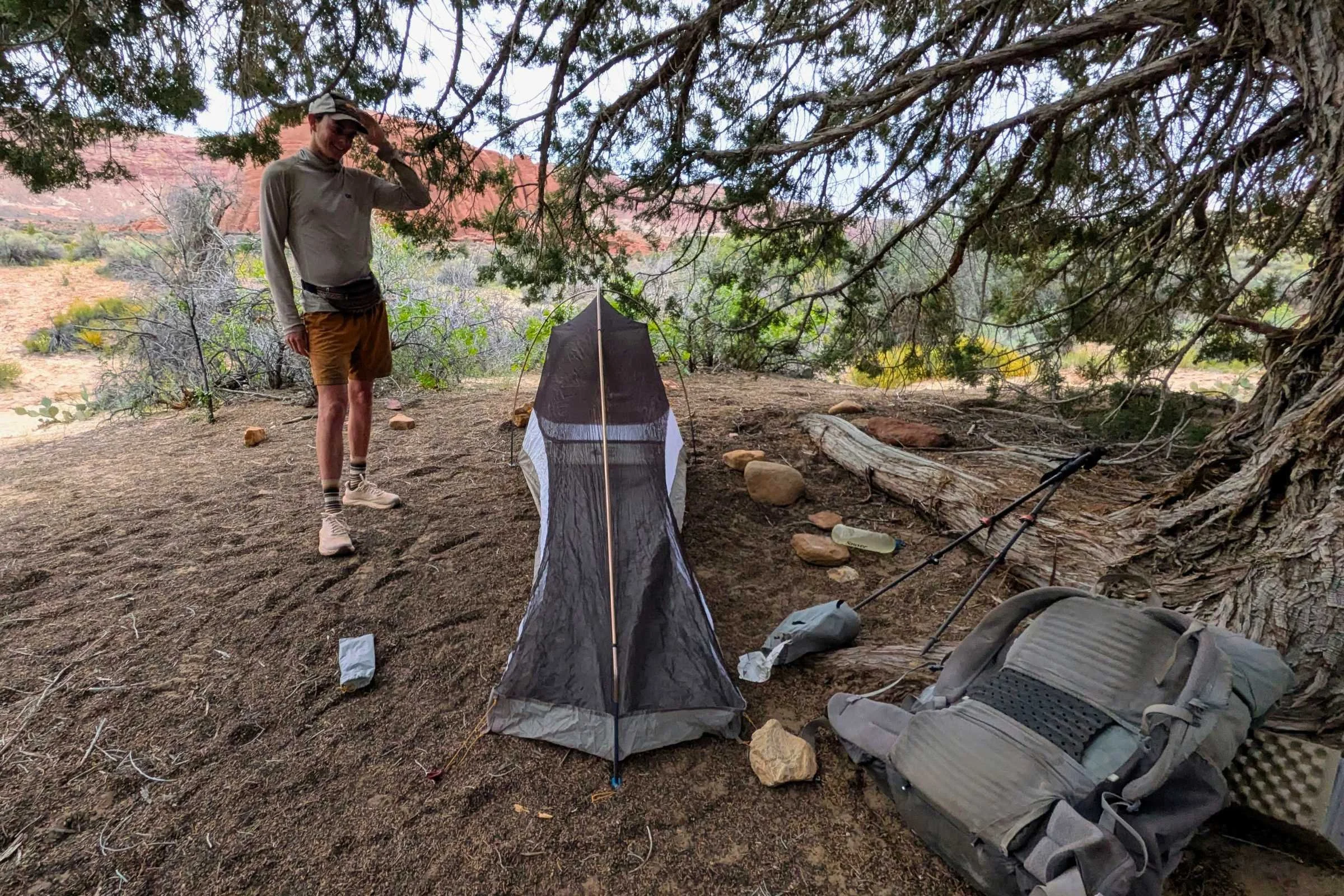 Backpacker next to narrow Mountain Hardwear Nimbus UL tent