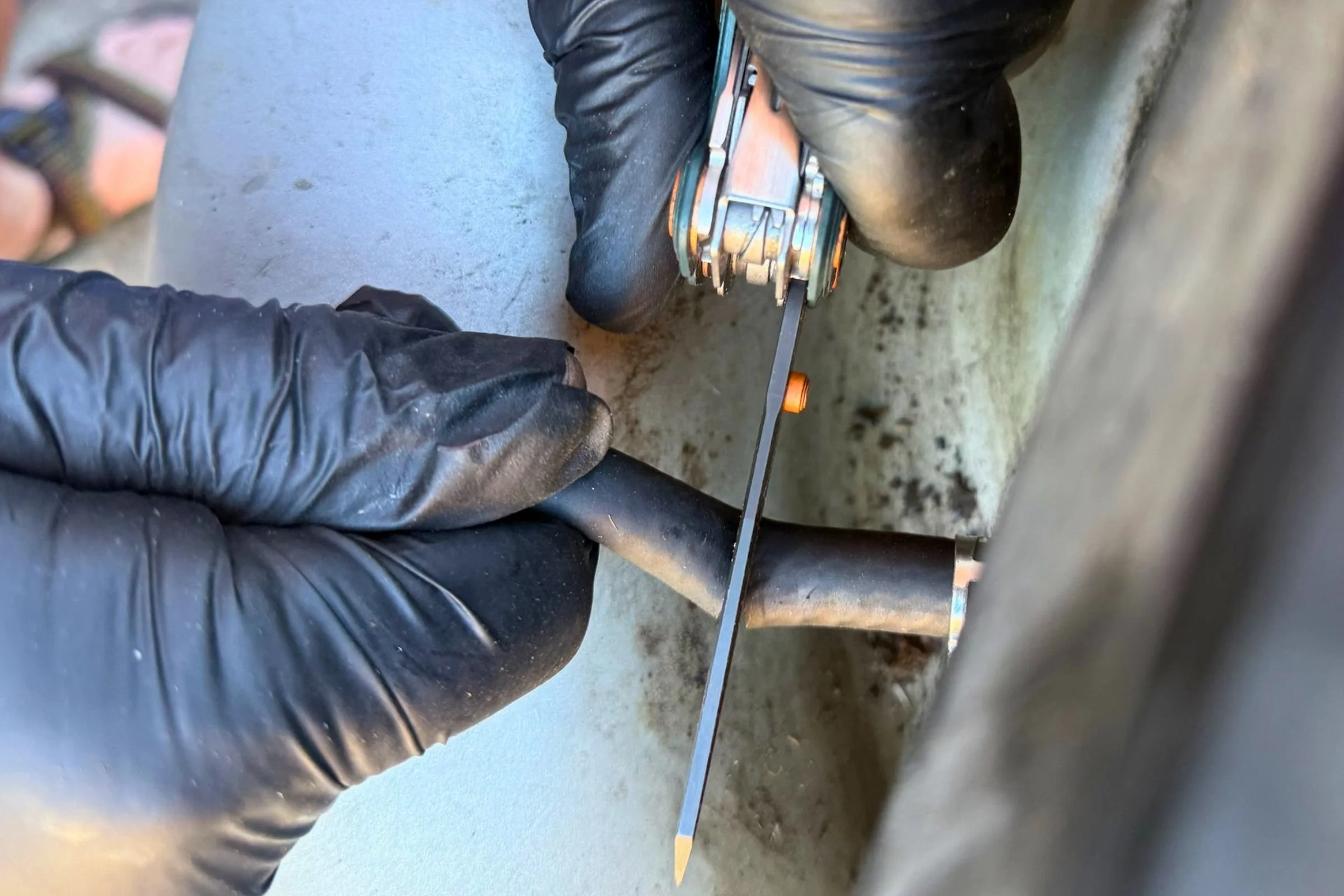 The blade on the Leatherman Wave Alpha made quick work of this gas hose. Courtesy Chris Meehan