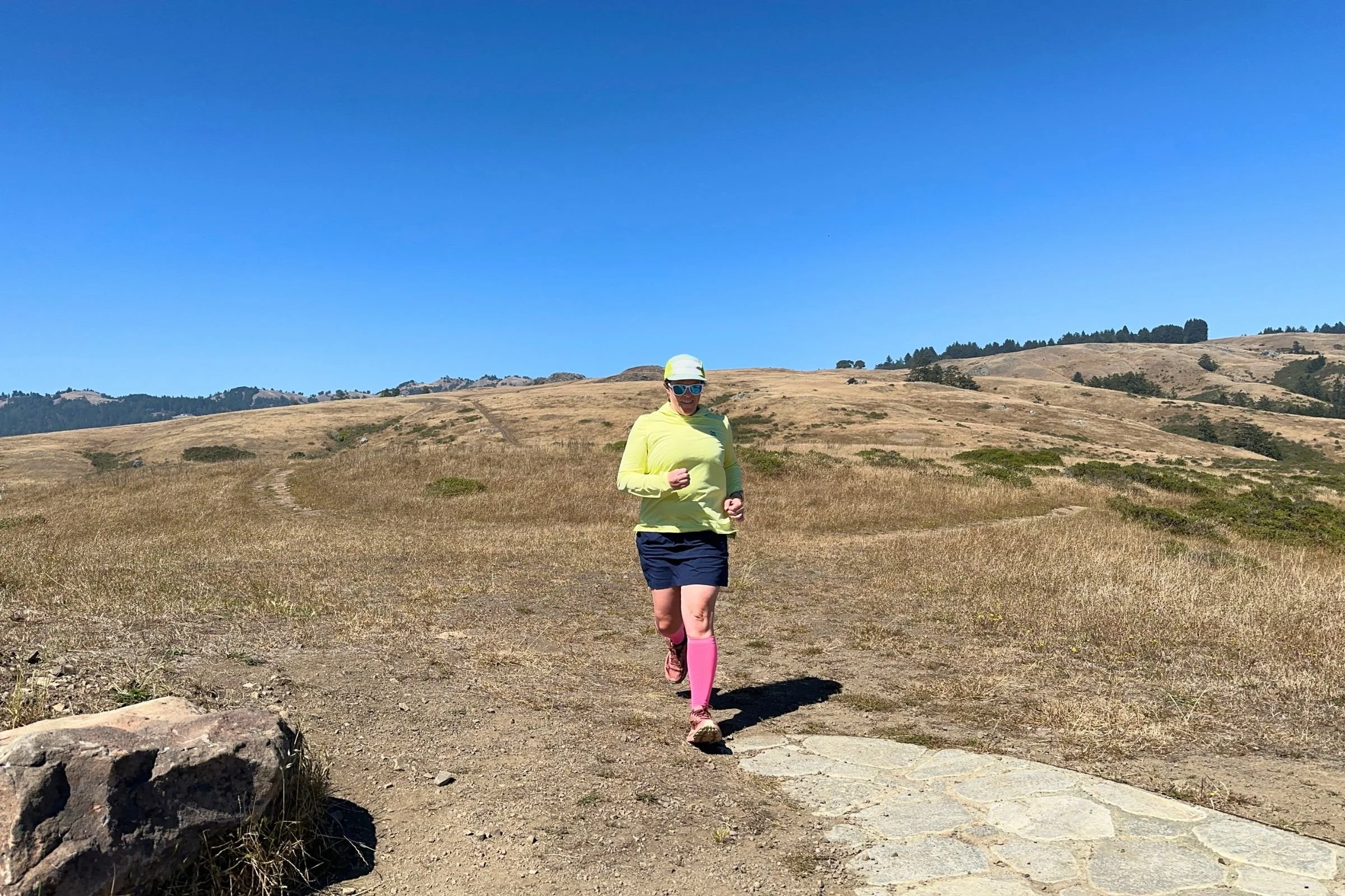 jogging along a rocky trail testing calf compression sleeves