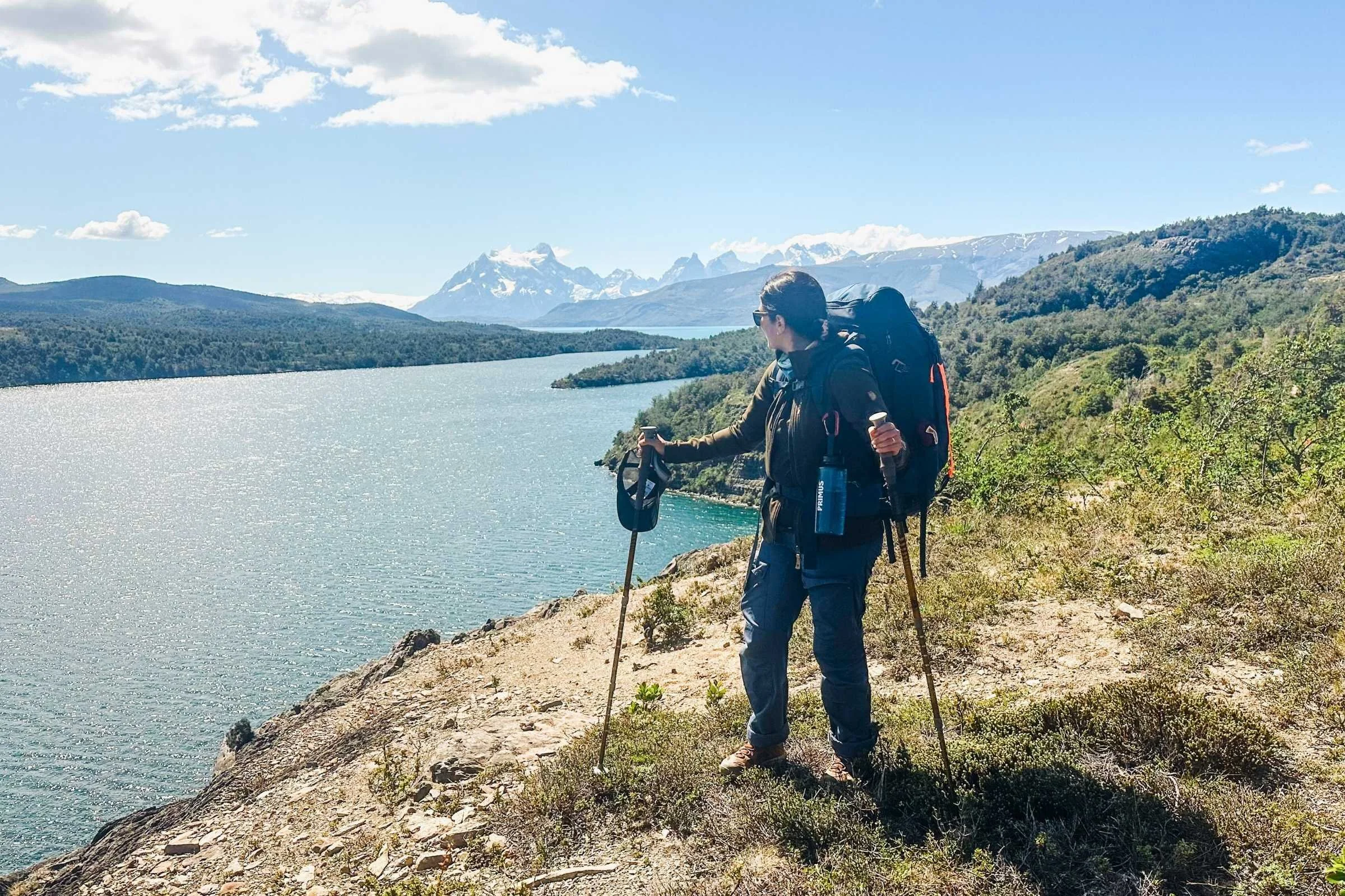 the author backpacking with a lake in the background