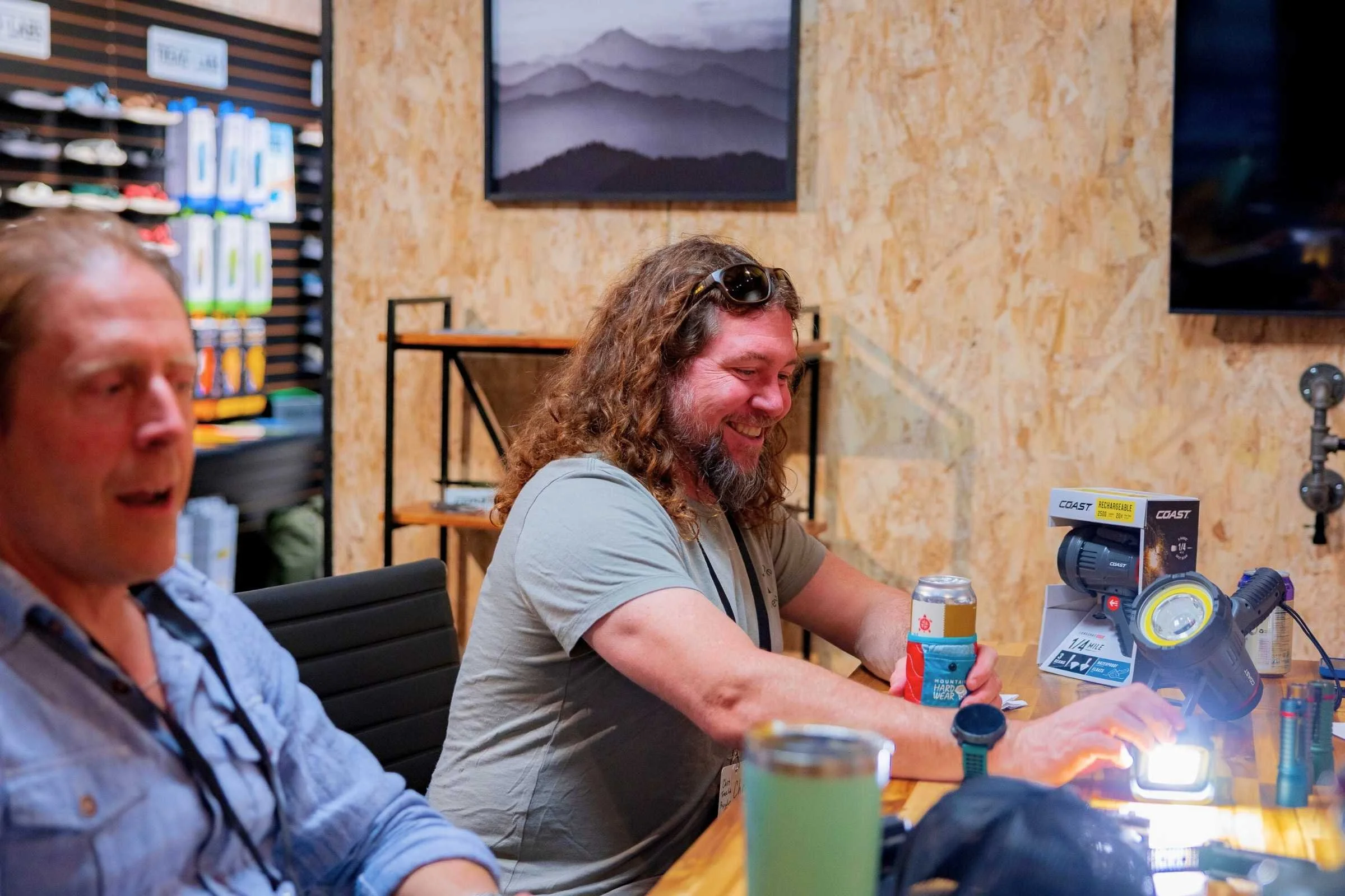 Chris testing out a COAST rechargeable light at the Outdoor Market Alliance show.