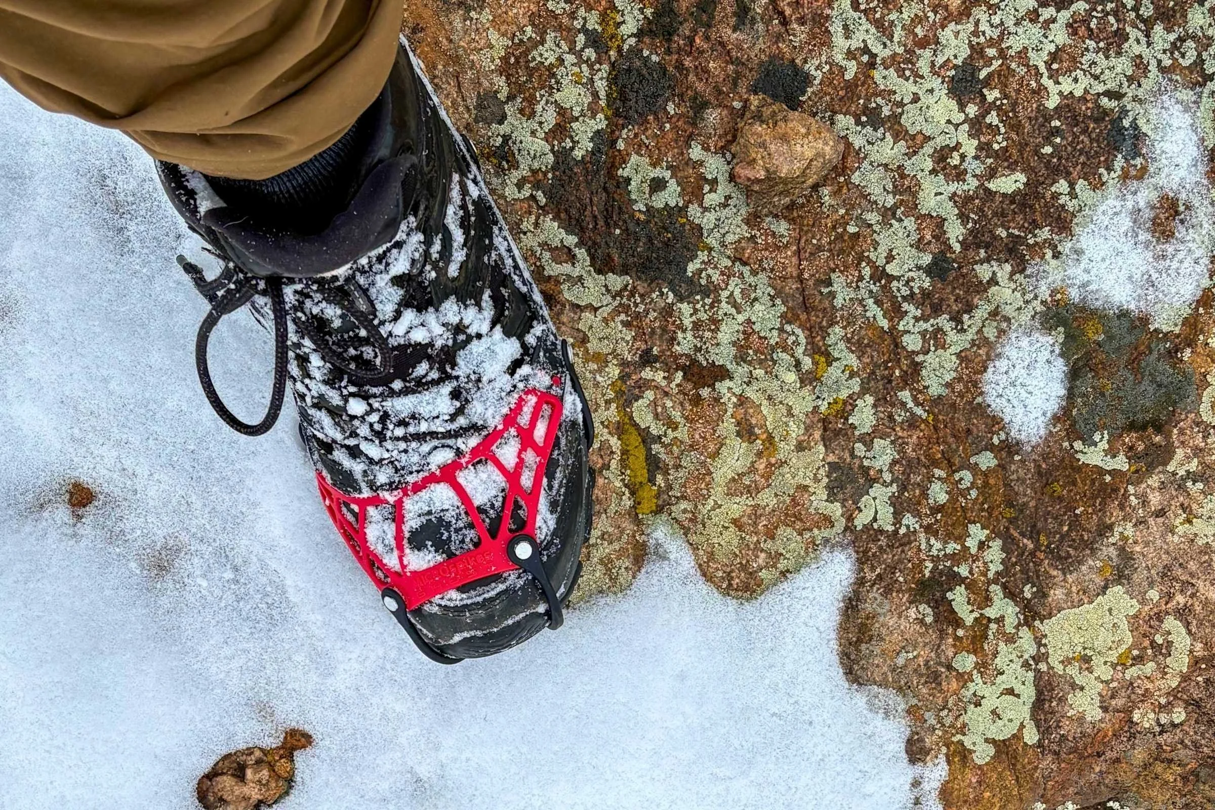 A microspikes ghost on a boot hiking in the snow