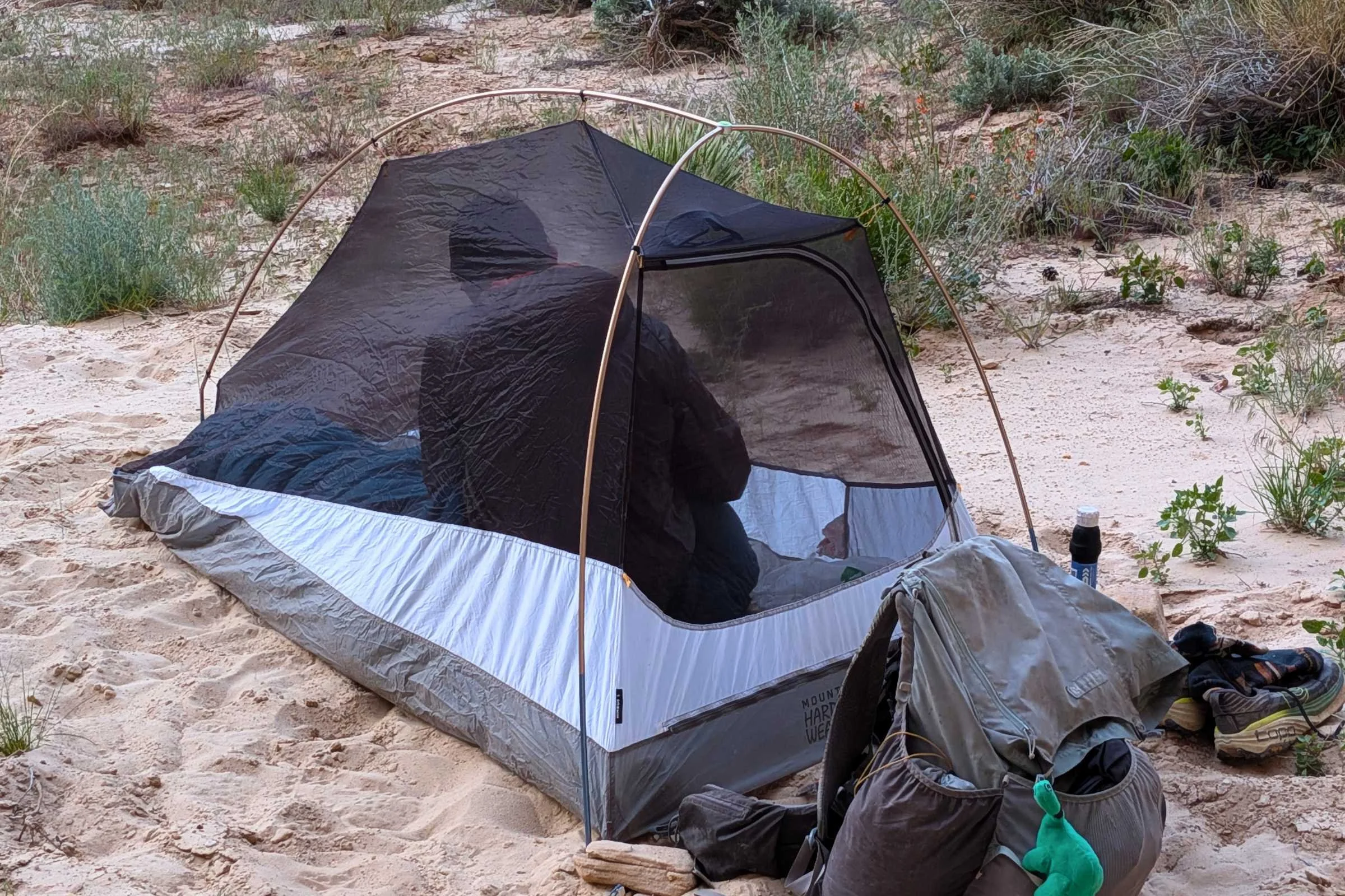 Backpacker in sand in the Mountain Hardwear Nimbus UL tent