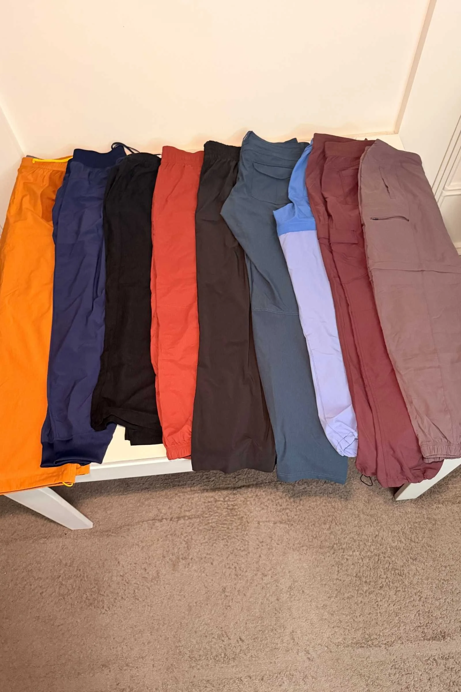 Travel pants laid out after being packed in a bag, showing wrinkle resistance