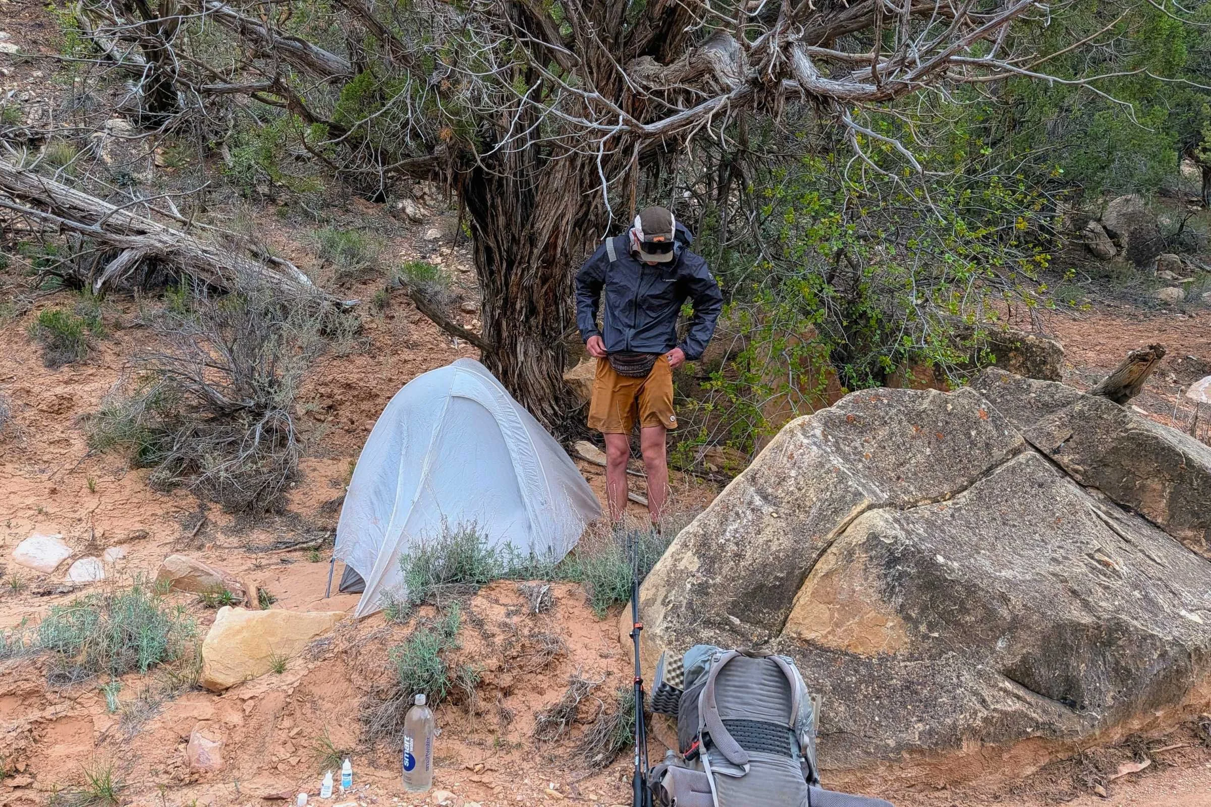 Backpacking standing in front of the Mountain Hardwear Nimbus tent