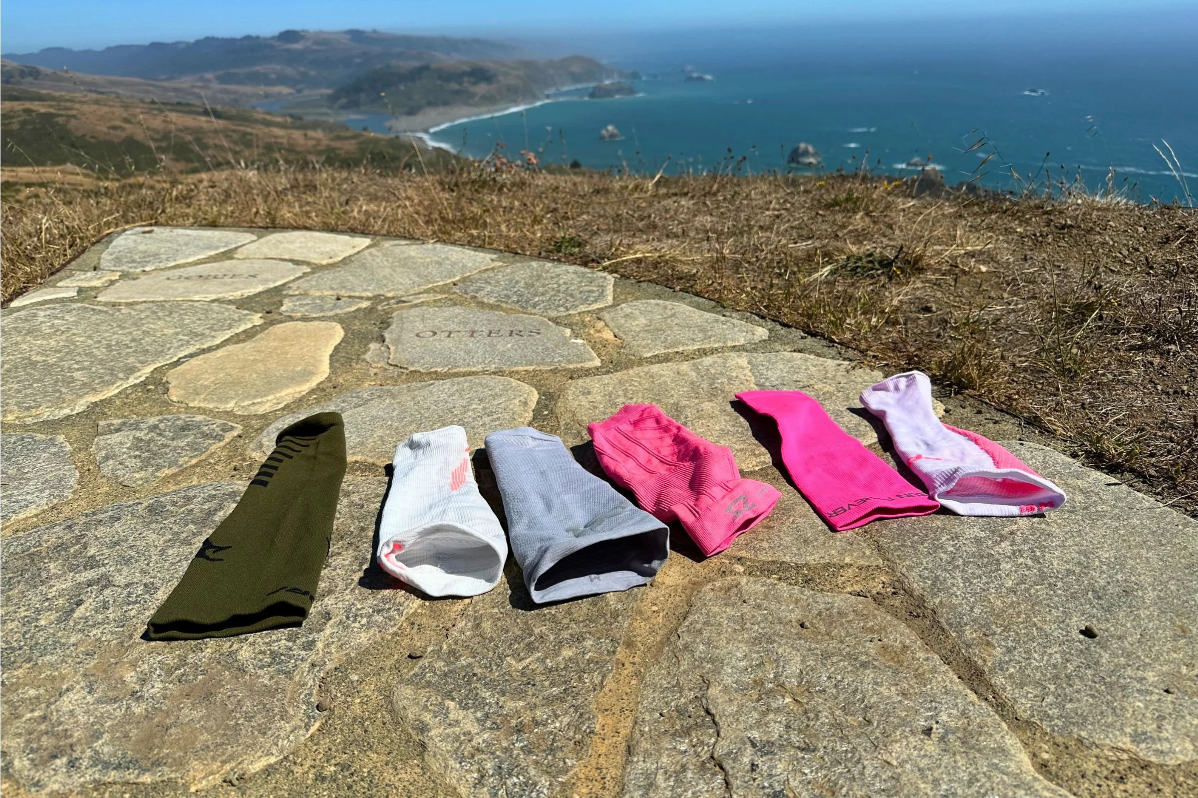 compression sleeves laid on the rocks,