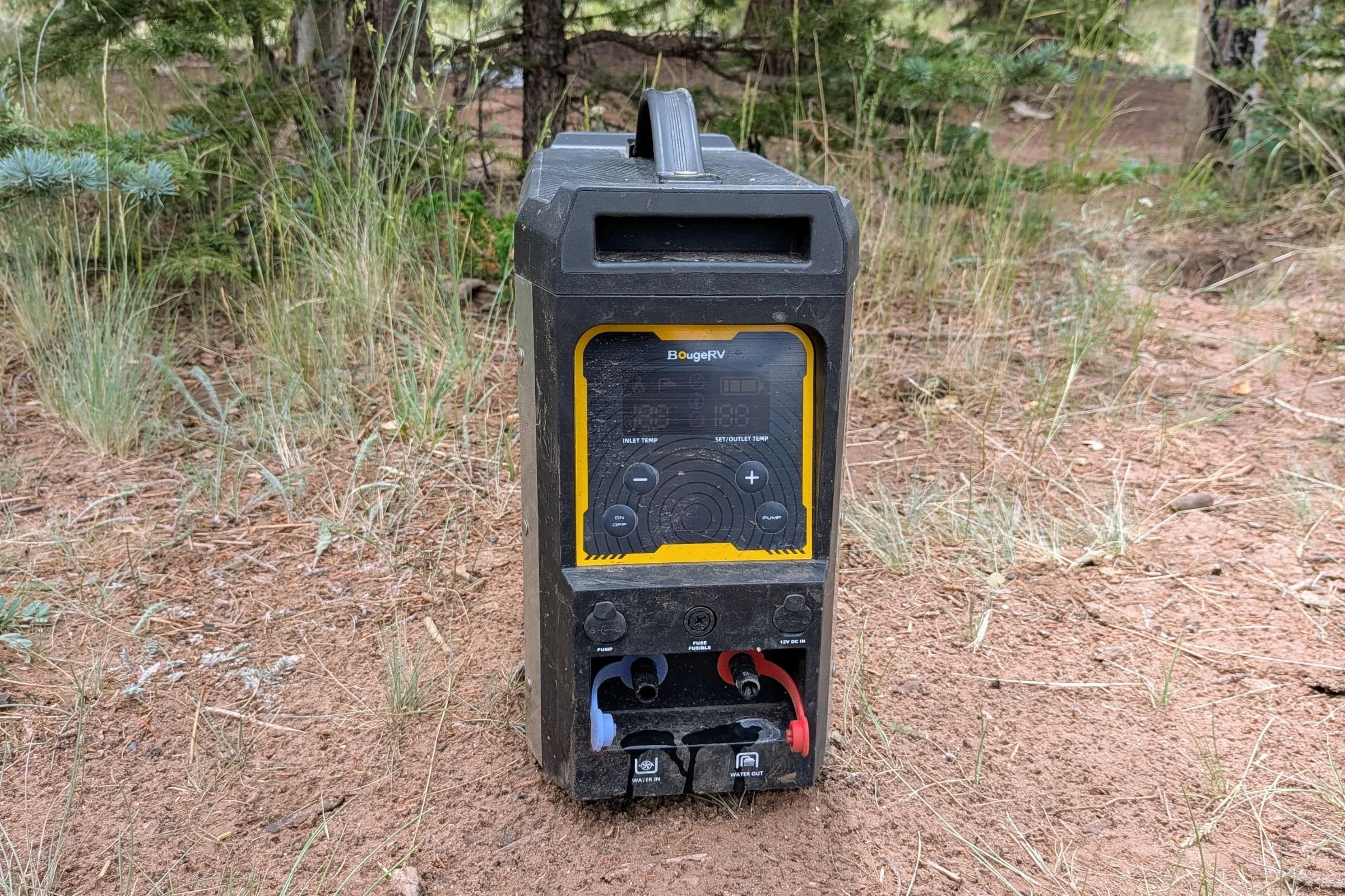 BougeRV Portable Propane Outdoor Water Heater shown in a field outdoors.