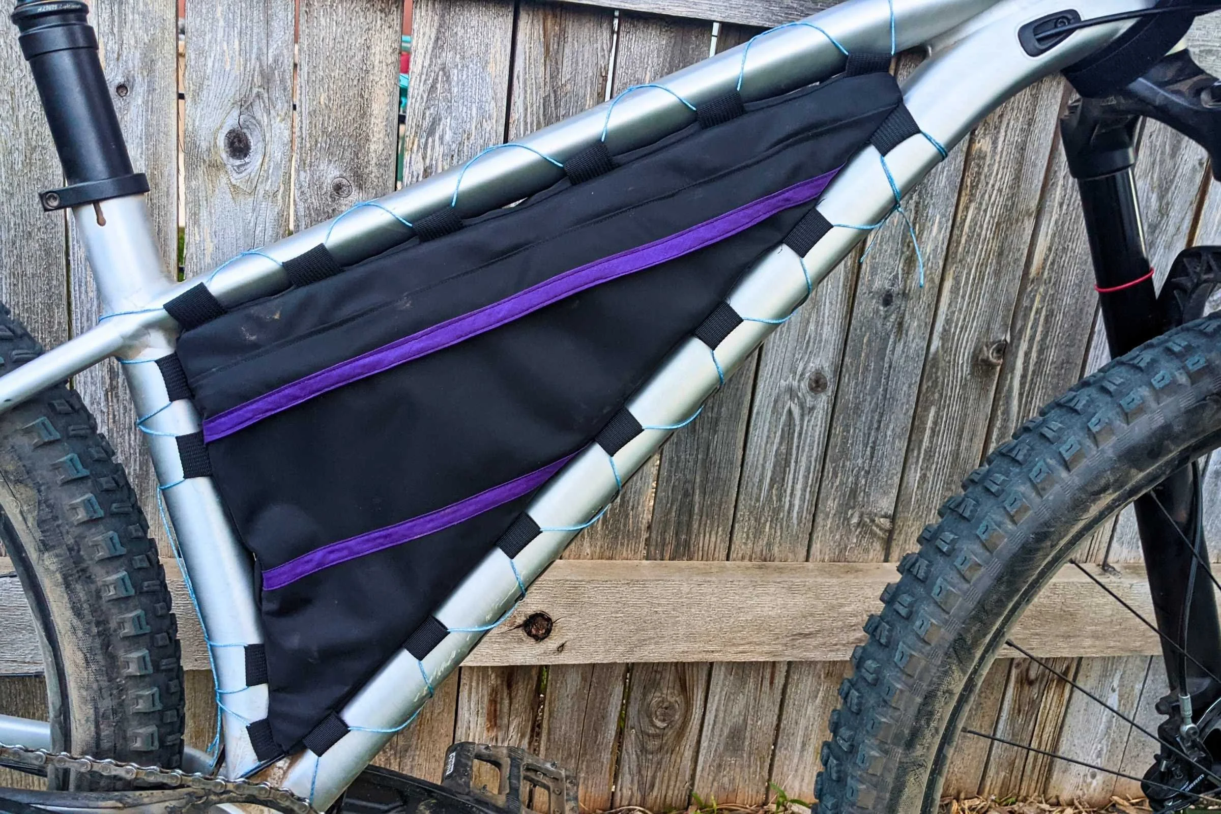 Higher end frame bags, especially those that are custom, may use laces as their attachment system.