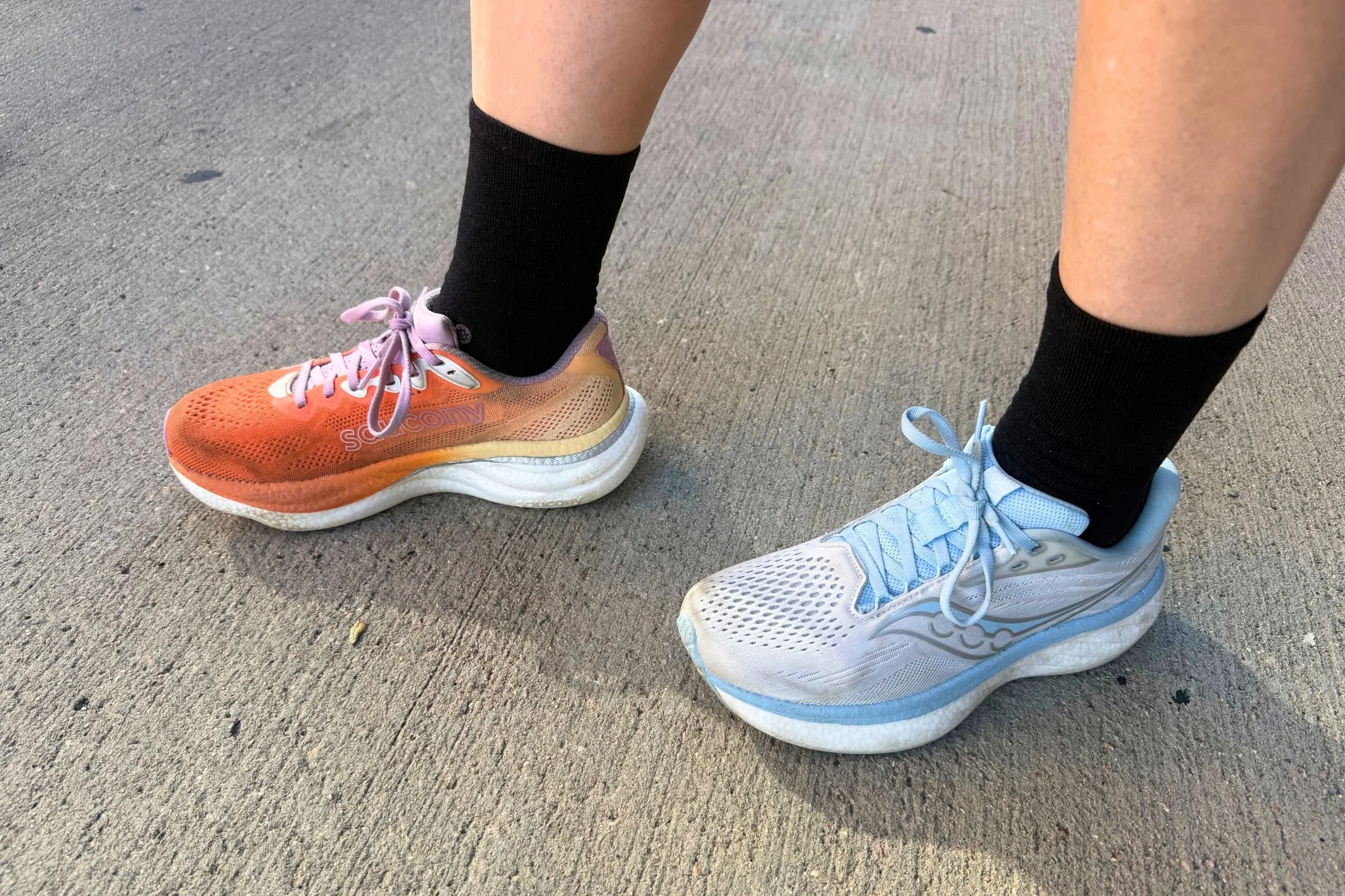 Person wearing the Saucony Ride 19 on their right foot and the Saucony Ride 18 on their left foot.