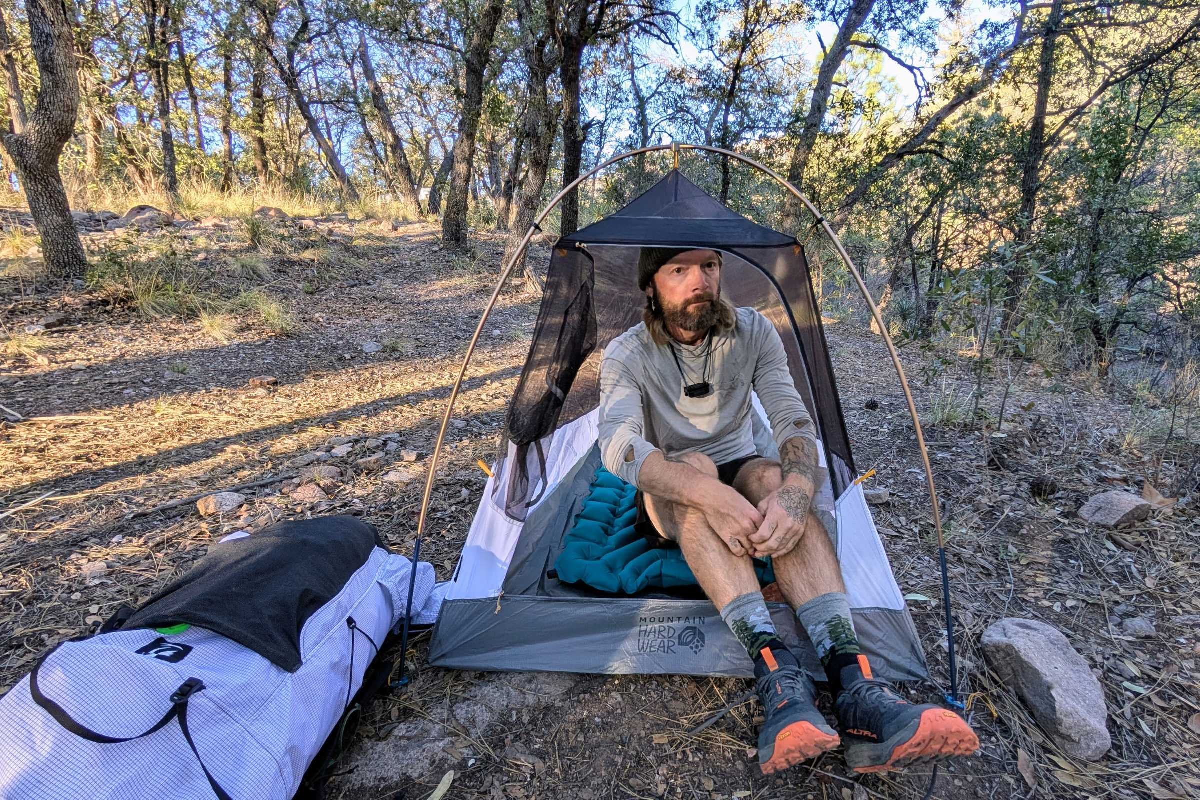 Author Sam Schild sitting in the Mountain Hardwear Nimbus tent