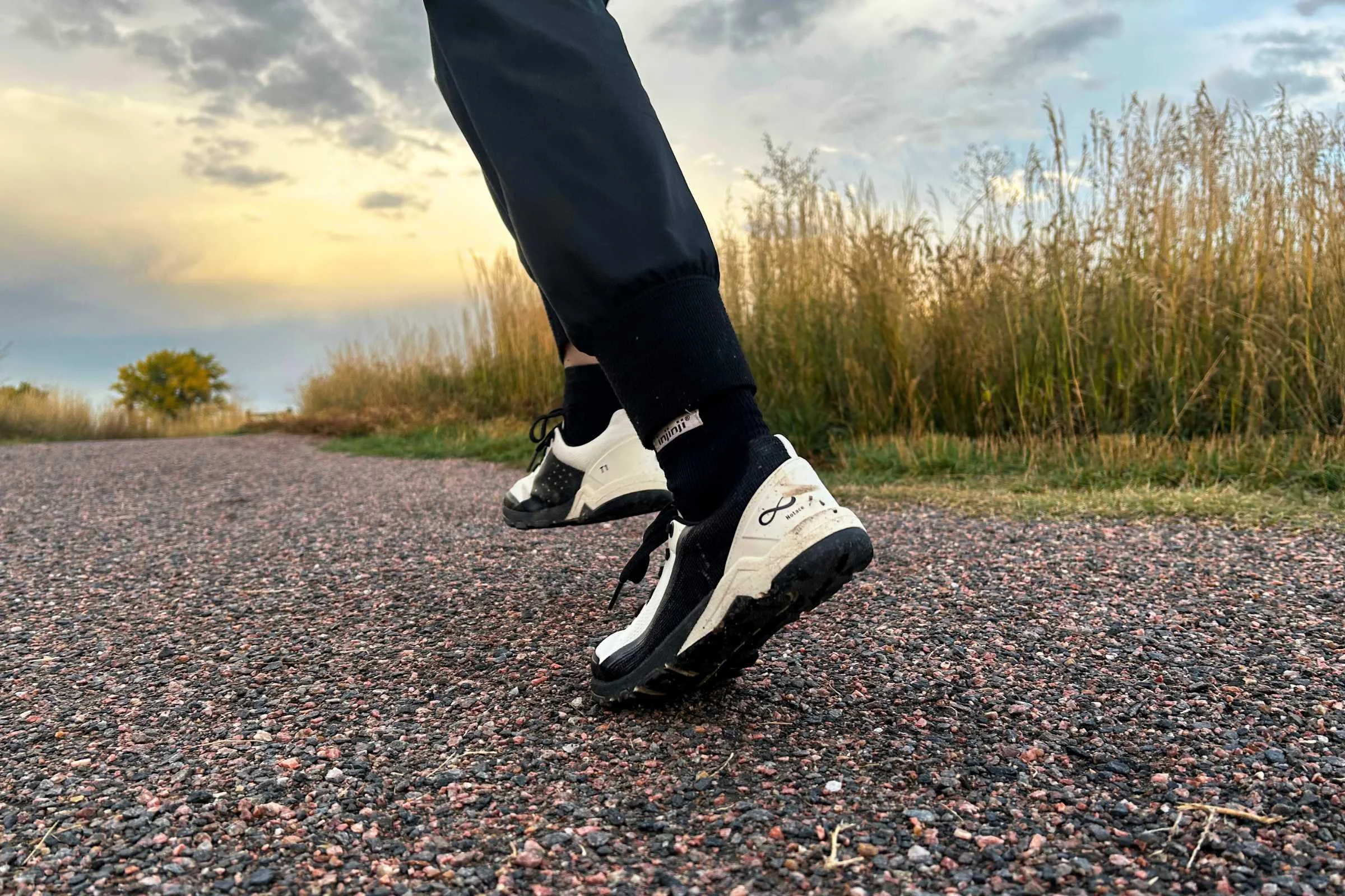 Mary running sprints across some local gravel trails.