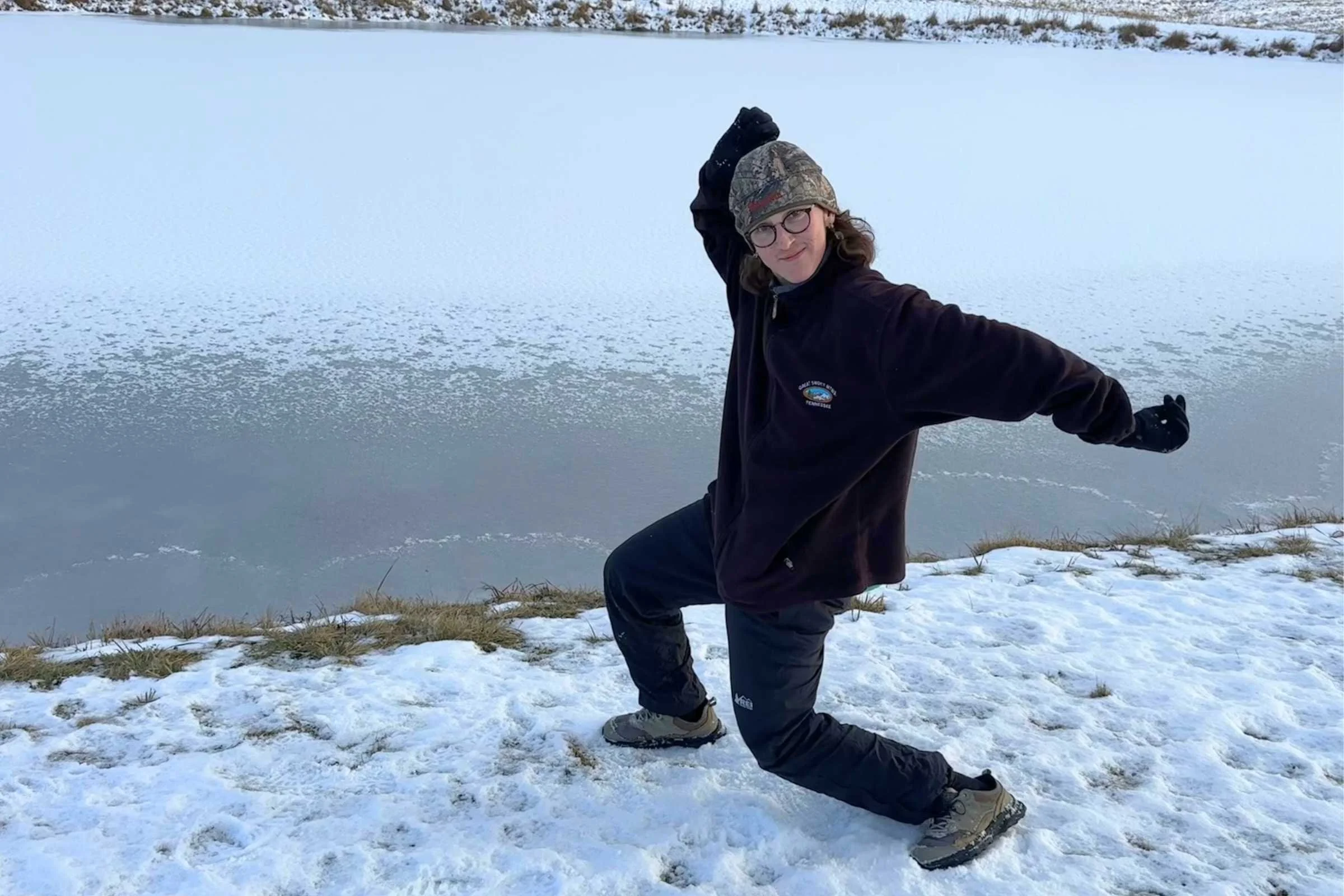 REI Co-op XeroCloud rain pants worn by Elliot in an odd pose.