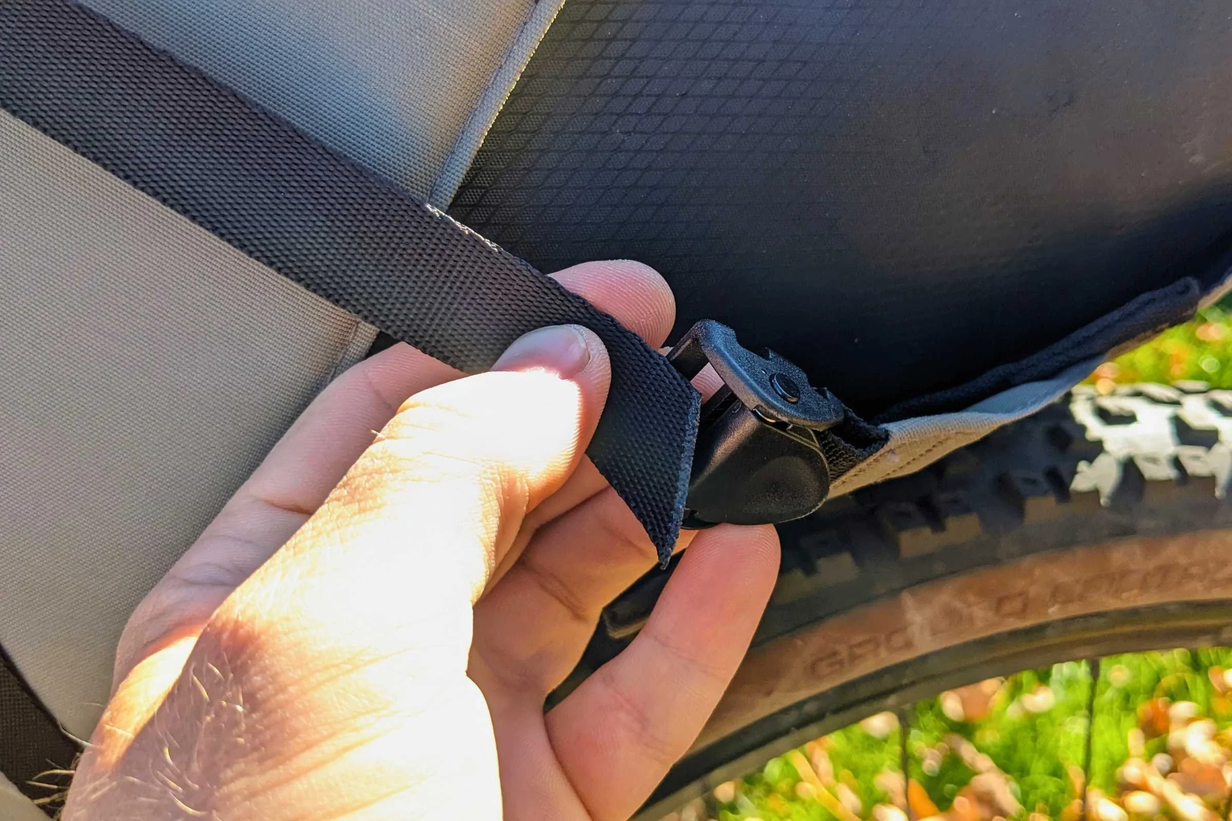 The Topeak Backloader X uses camming buckles to attach the saddle bag to your bike's seat.