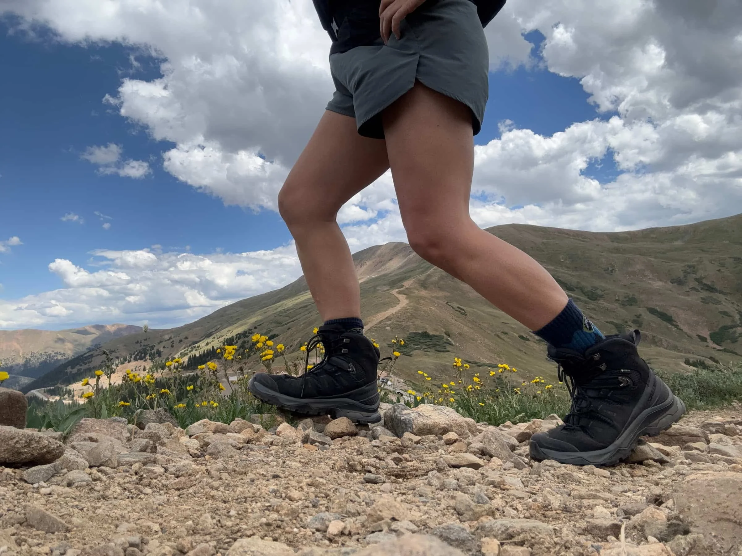 Close-up of Salomon Quest 5 boots above treeline with flowers