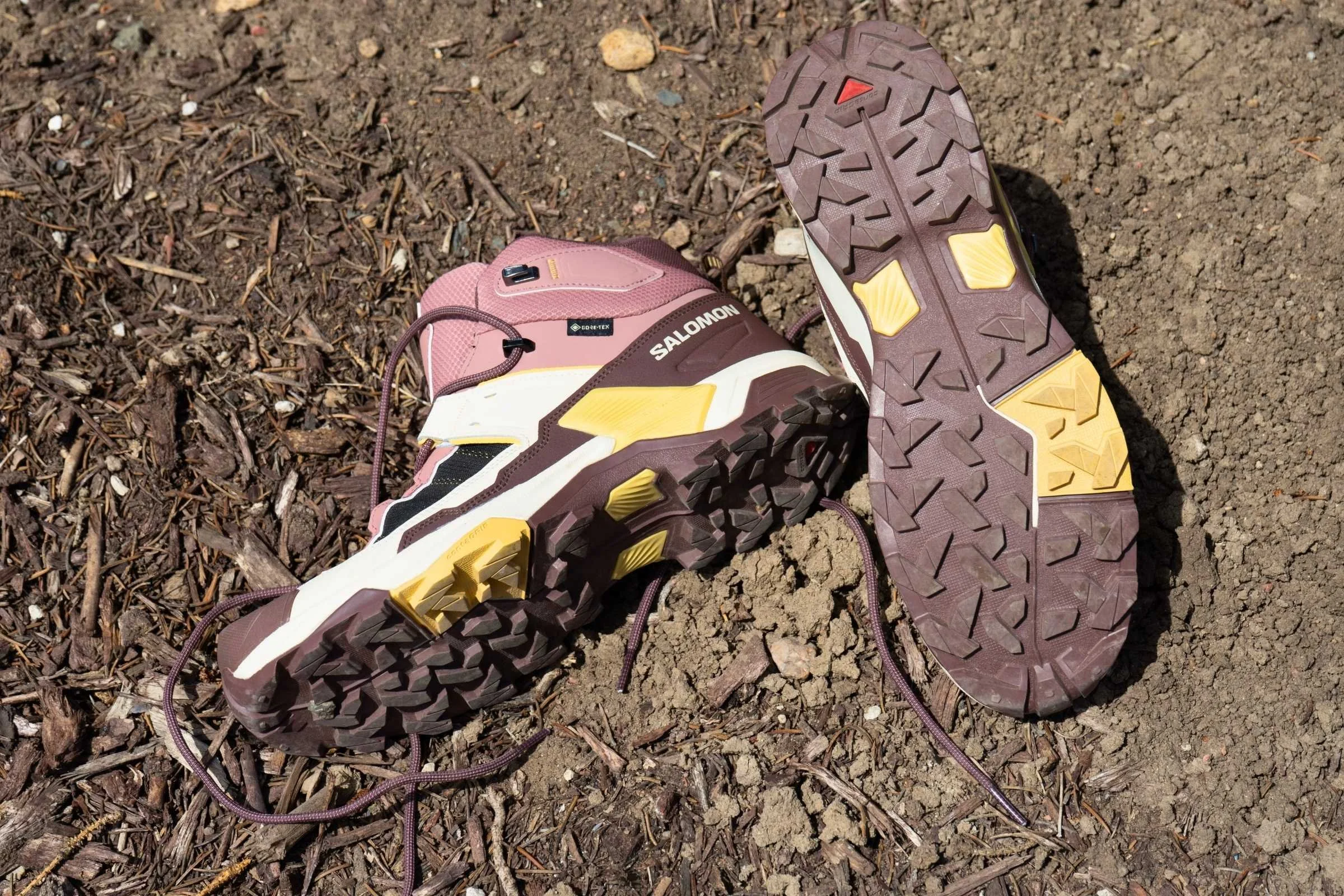 Salomon X Ultra 5 Mid GTX Hiking boots on a trail showing the lugs