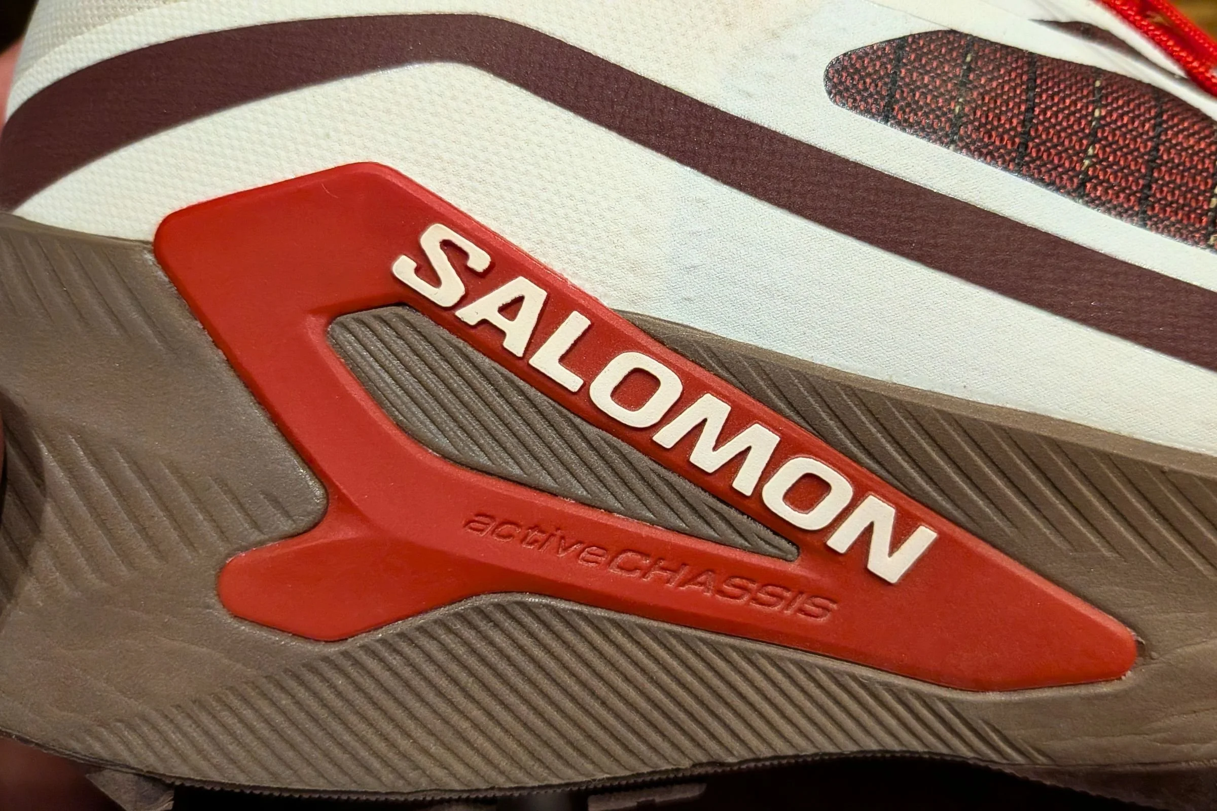 Close-up shot of Salomon activeCHASSIS sign on the shoe.