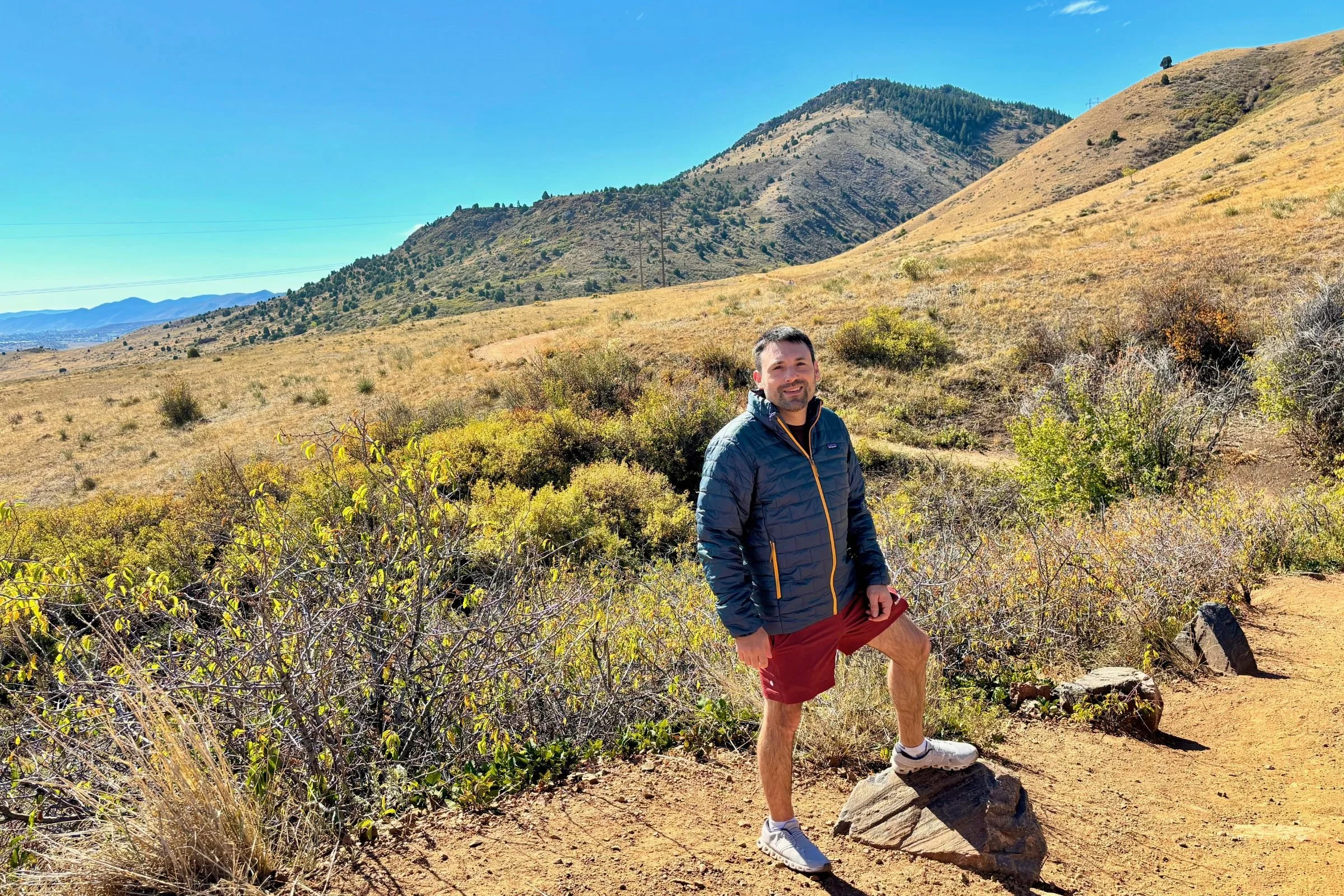 Man wearing Patagonia Nano Puff jacket on a sunny fall day.