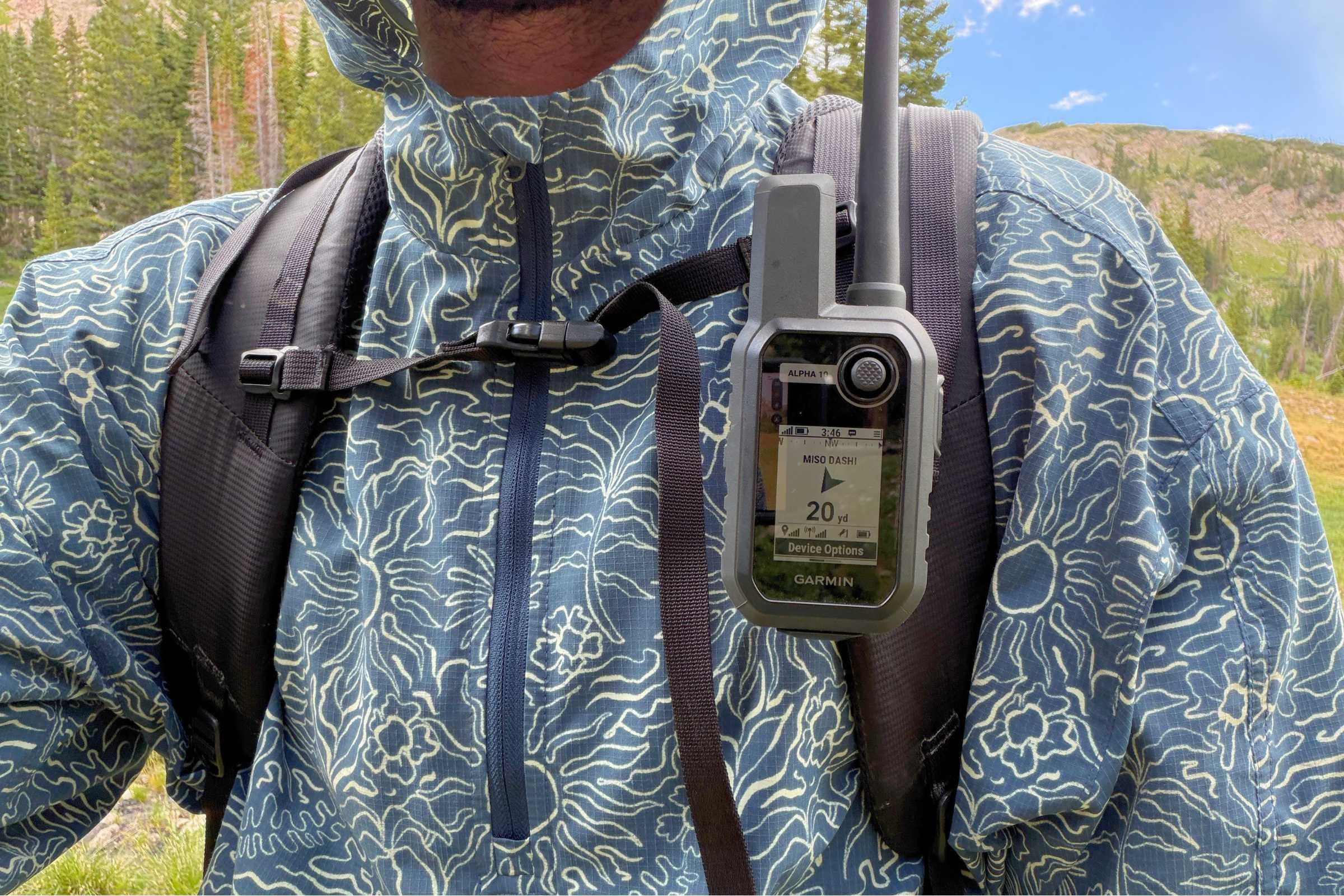 Garmin Alpha 10 handheld clipped onto a hiking pack