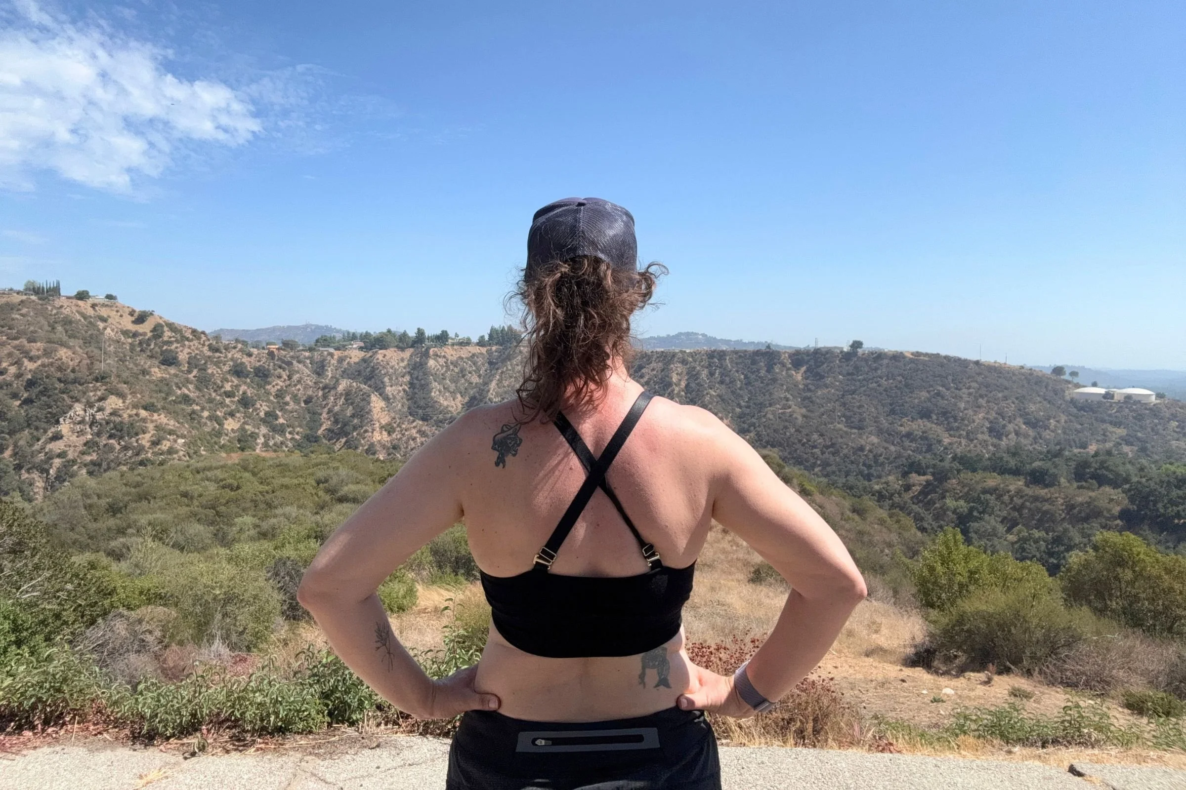 A back view of the author wearing a black BRANWYN Essential Supreme bra with the straps criss-crossed across the back.
