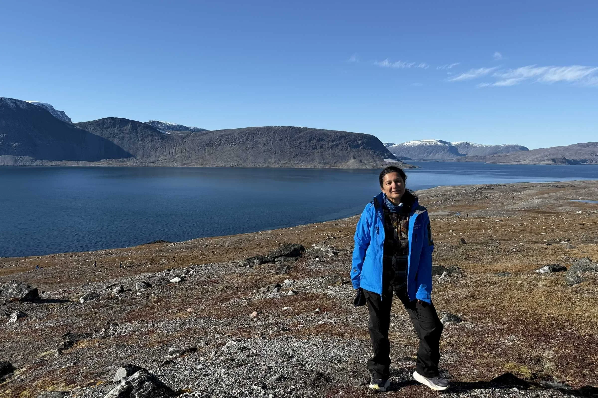the author with a lake in the background