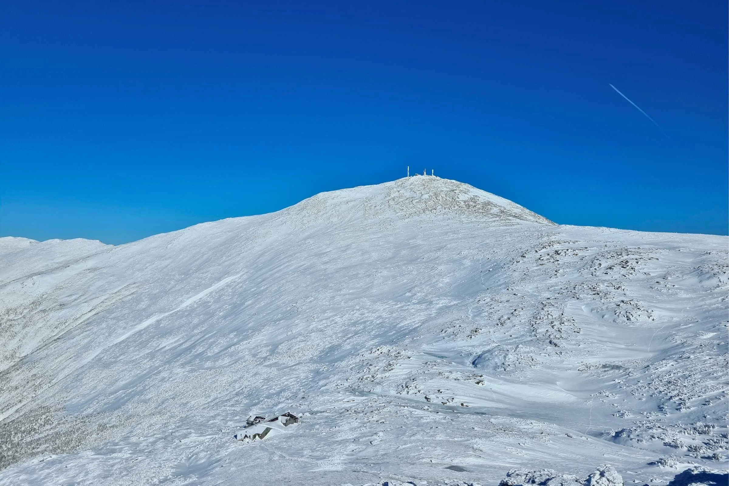 Mt. Washington and the Lake of the Clouds hut in January, as seen from the summit of Mt Monroe. Photo by Aubri Drake.