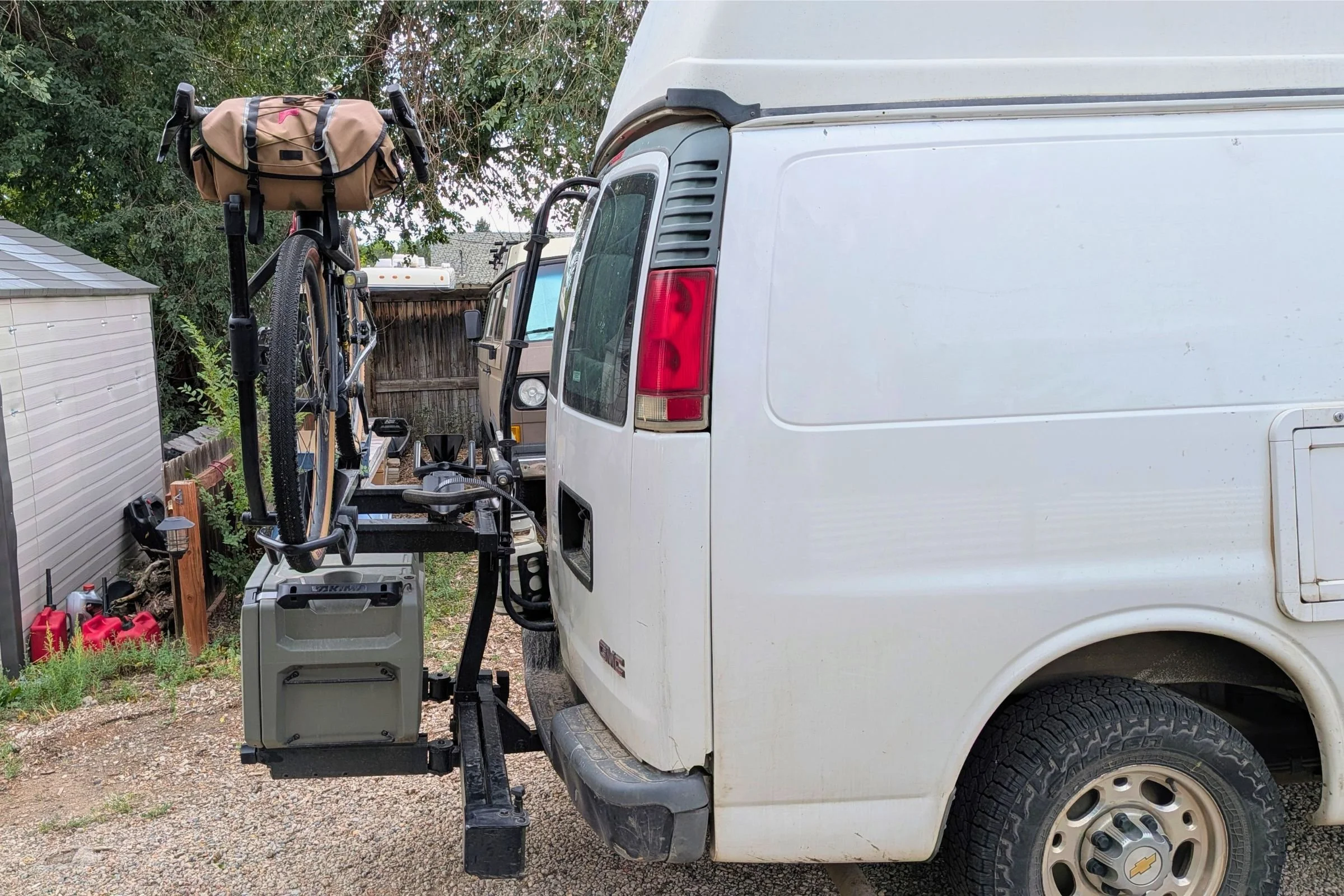 A bicycle is mounted on the back of a truck with a Yakima EXO DoubleUp 2-Bike Hitch Rack.