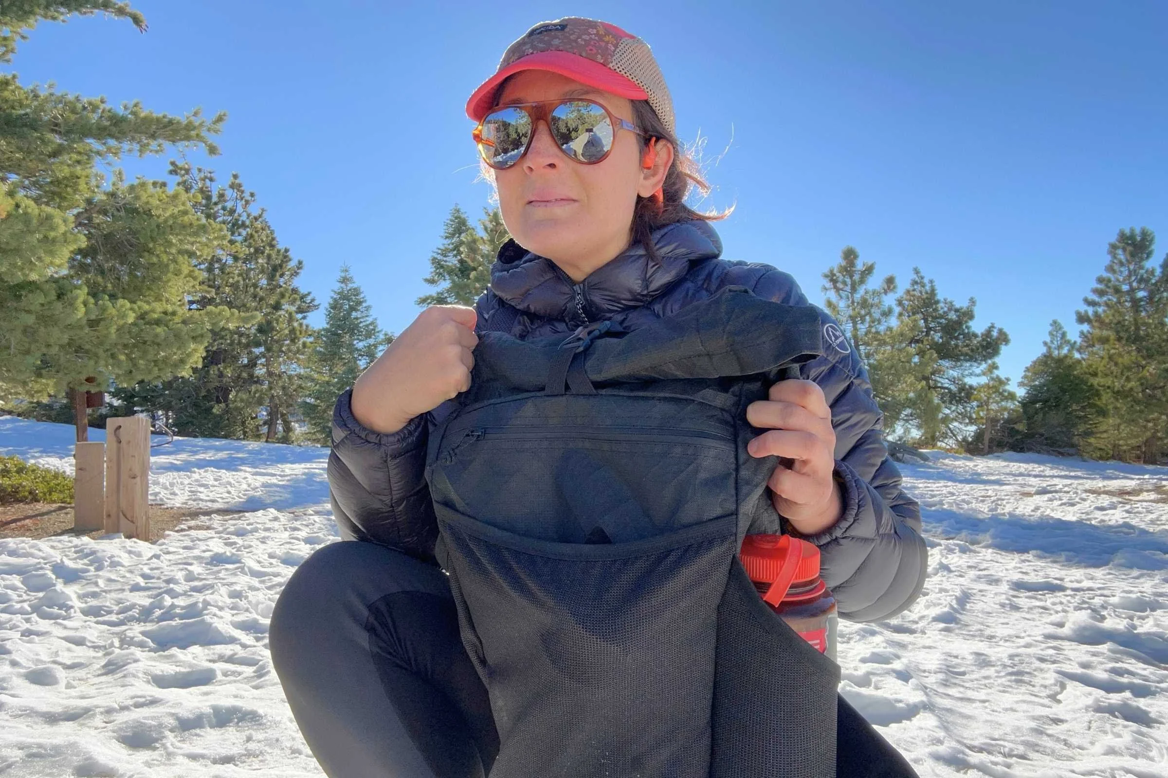 author wearing the ula ultra node 20l backpack on a snowy hike