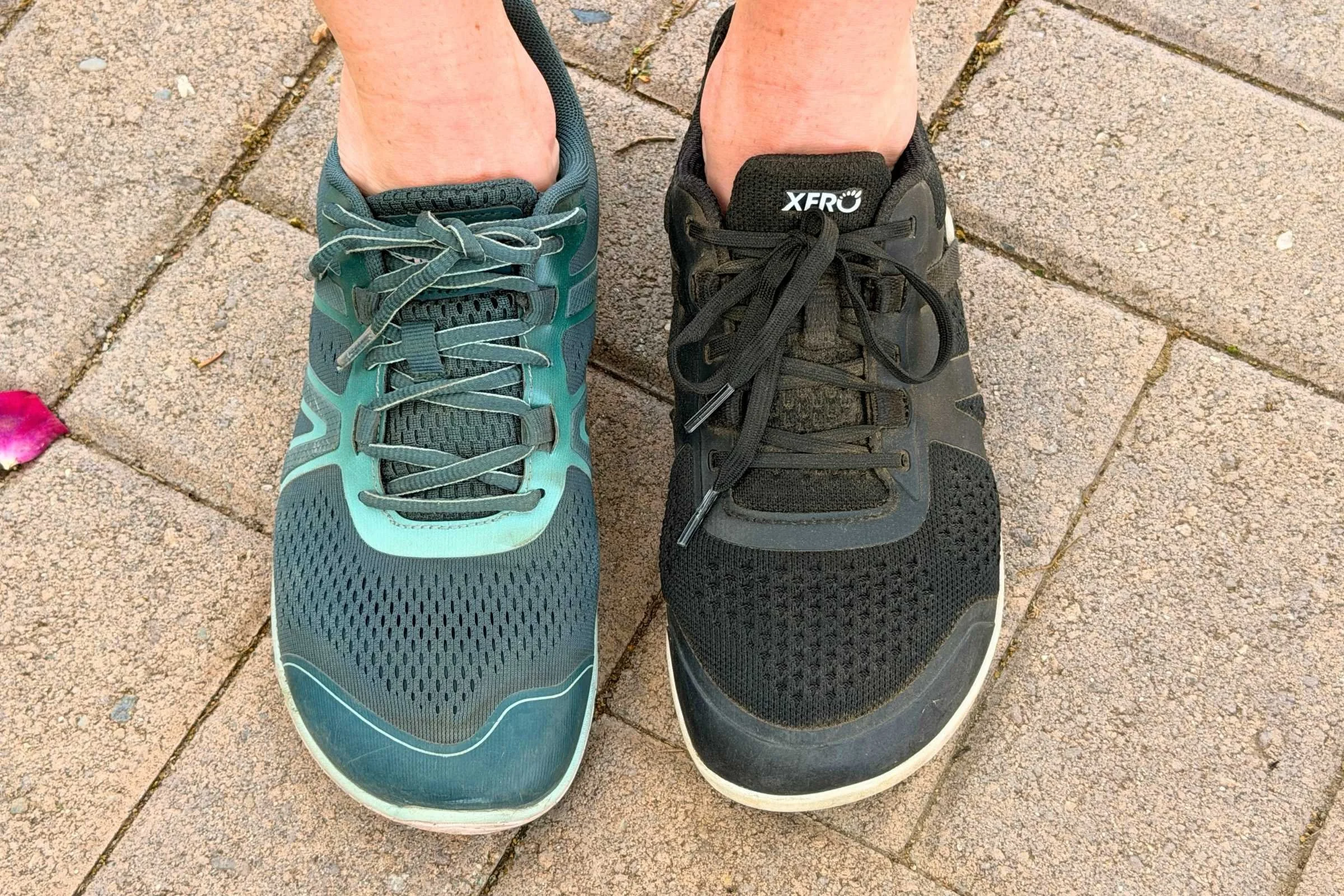 Person wearing a Xero HFS II on one foot and Xero Prio Neo on the other