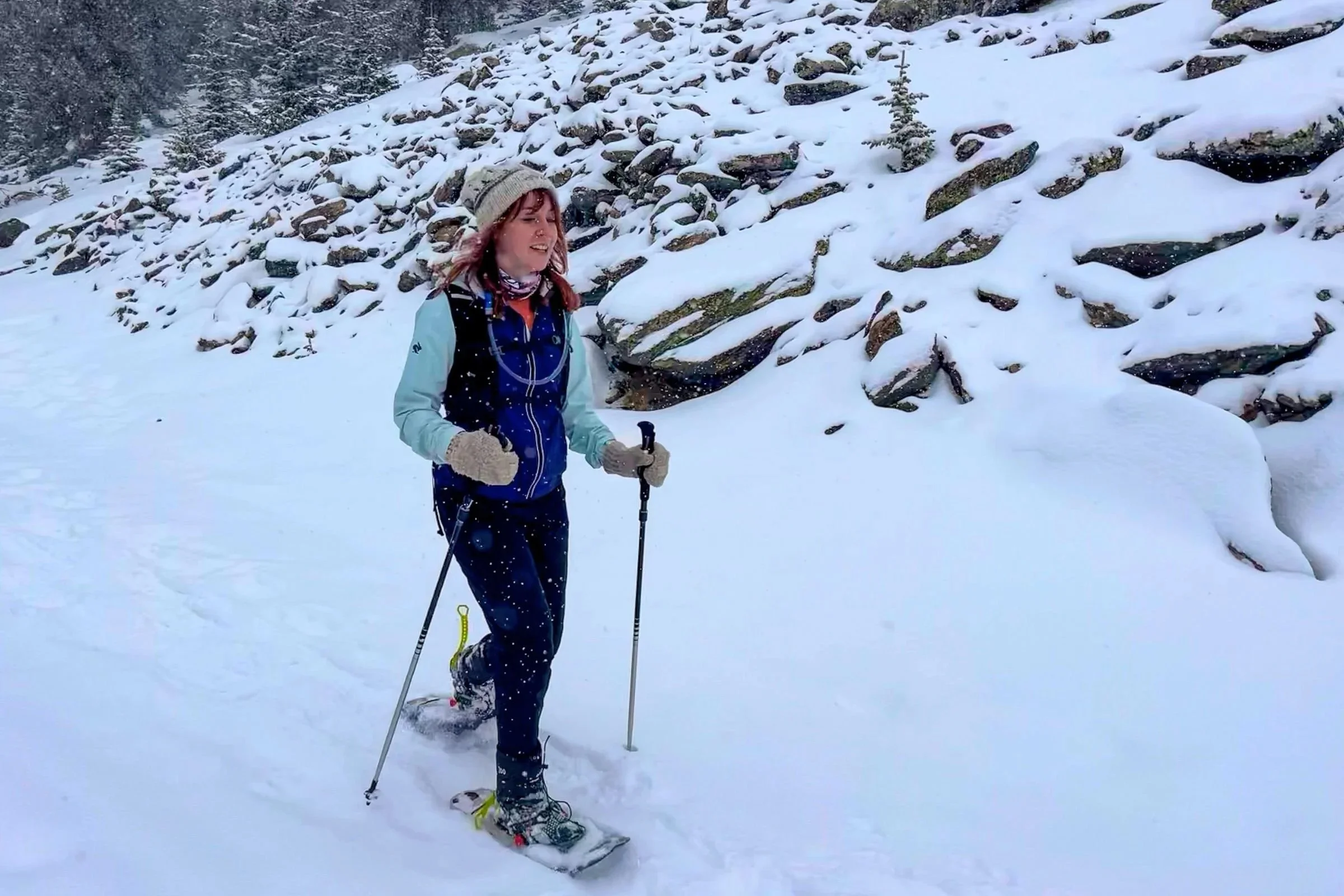 Person wearing MSR evo snowshoes on a snow covered trail