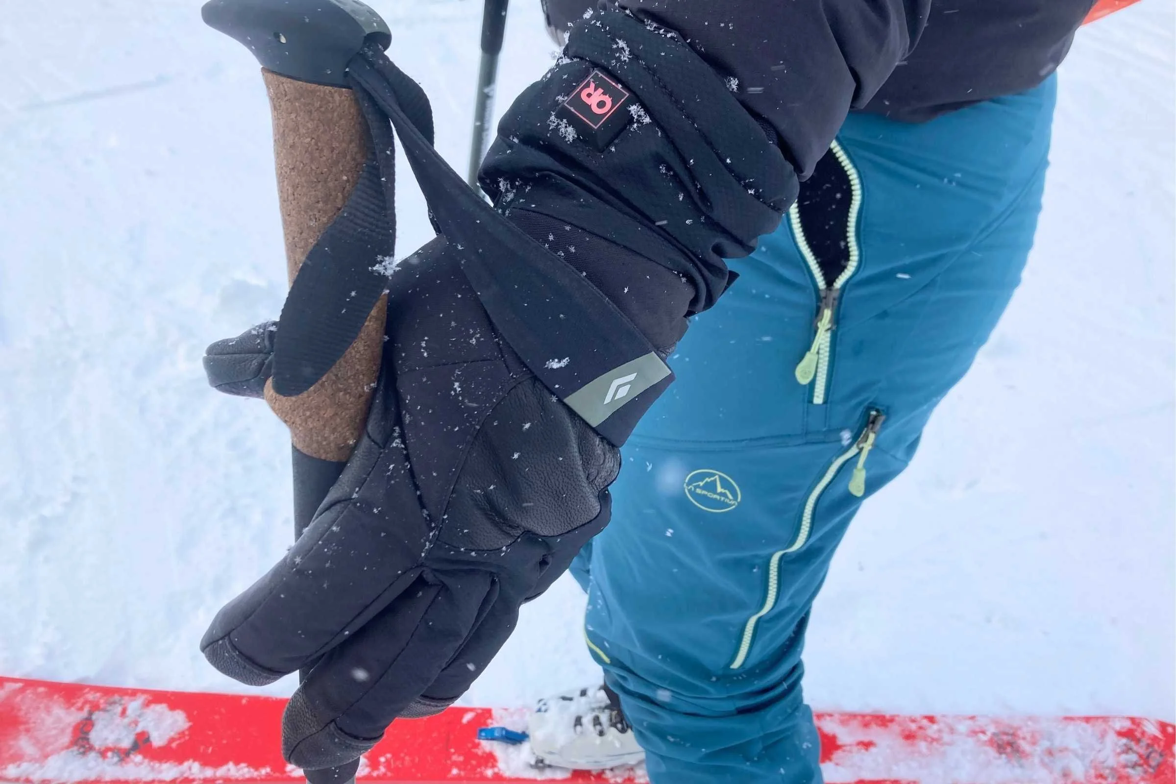 Outdoor Research Prevail Heated GTX gloved handed holding onto a ski pole