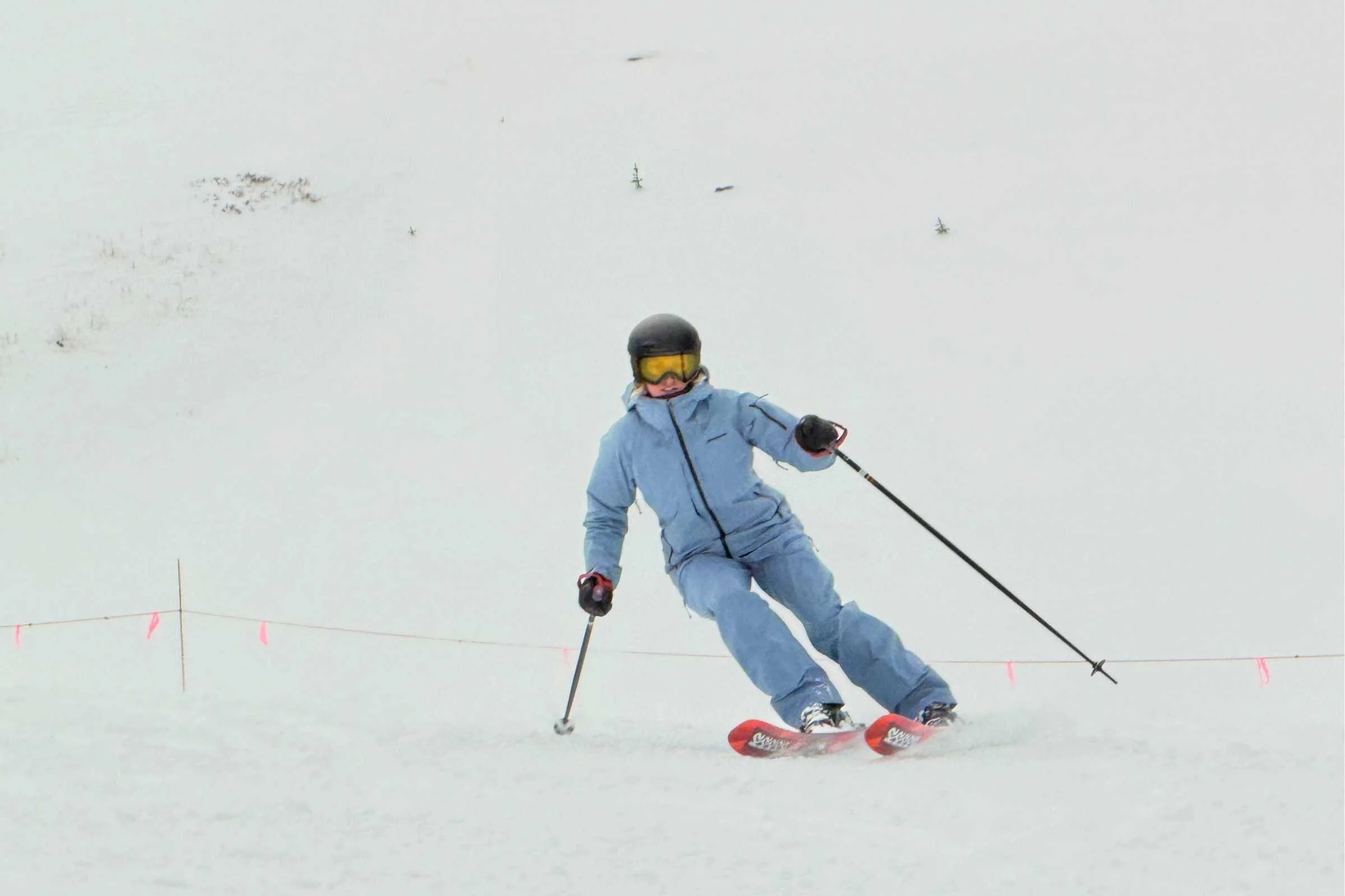 The author, our women’s tester, skiing in the PowSlayer kit on a grey and windy day at Arapahoe Basin.