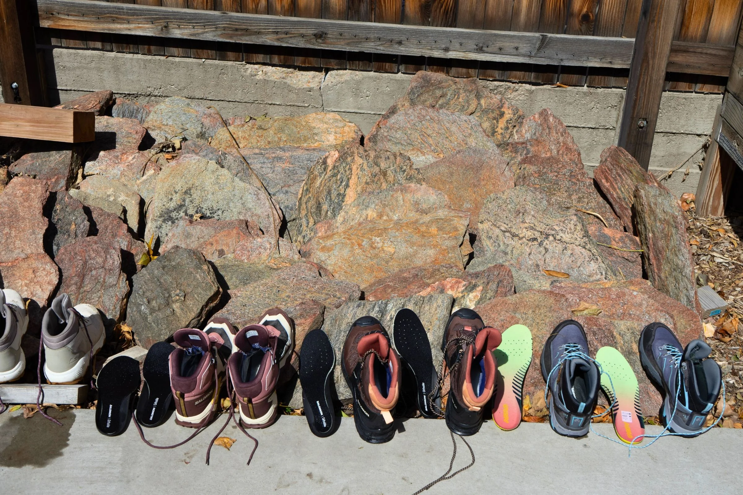 Women’s hiking boots we tested for this guide, lined up with their insoles removed.