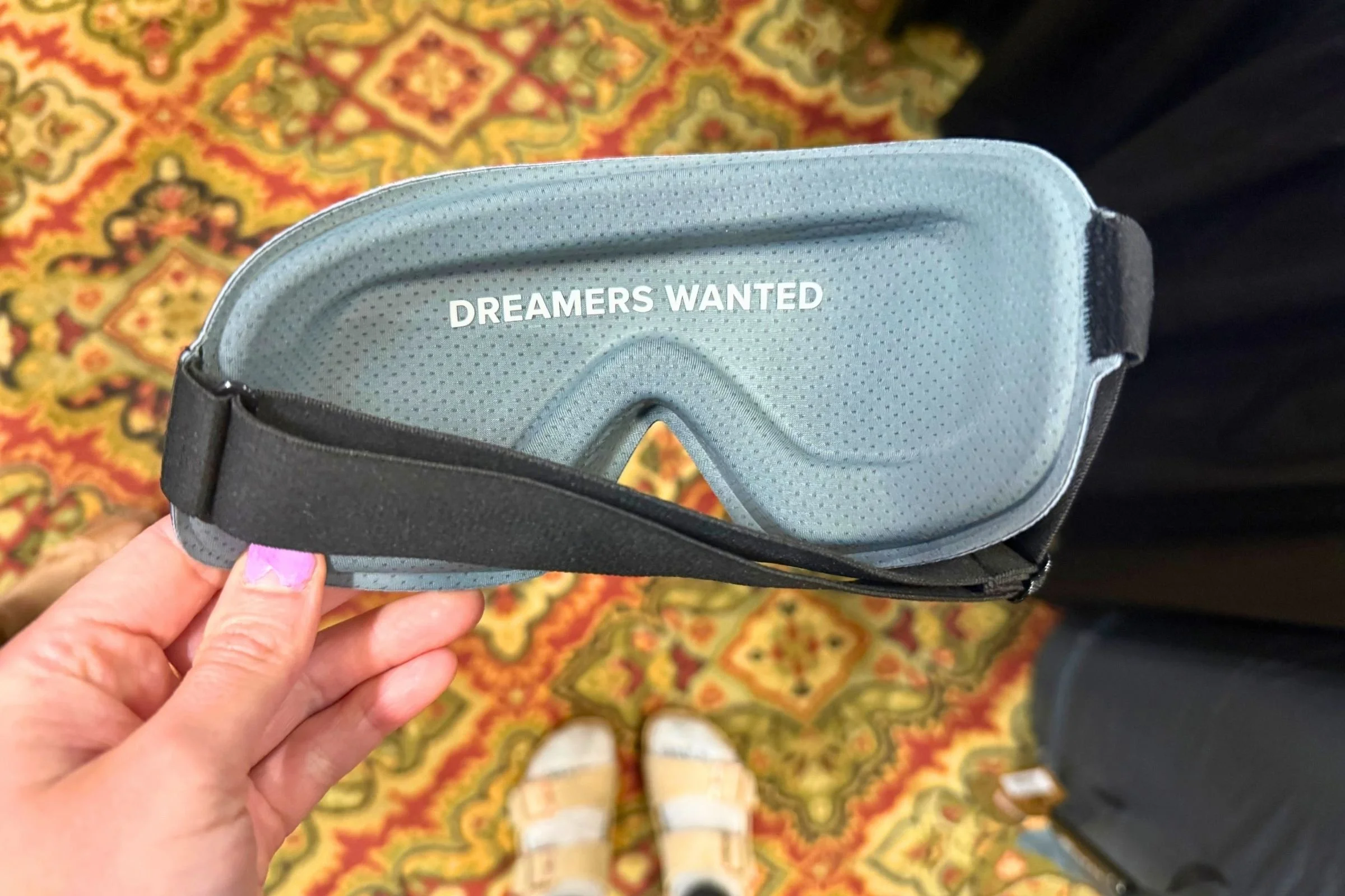 Sleeping mask with "dreamers wanted" written on the inside.