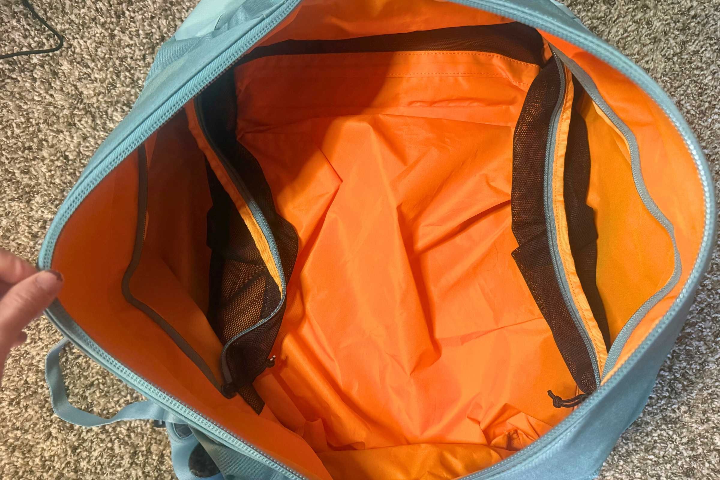 Spacious main compartment with two mesh zippered pockets.