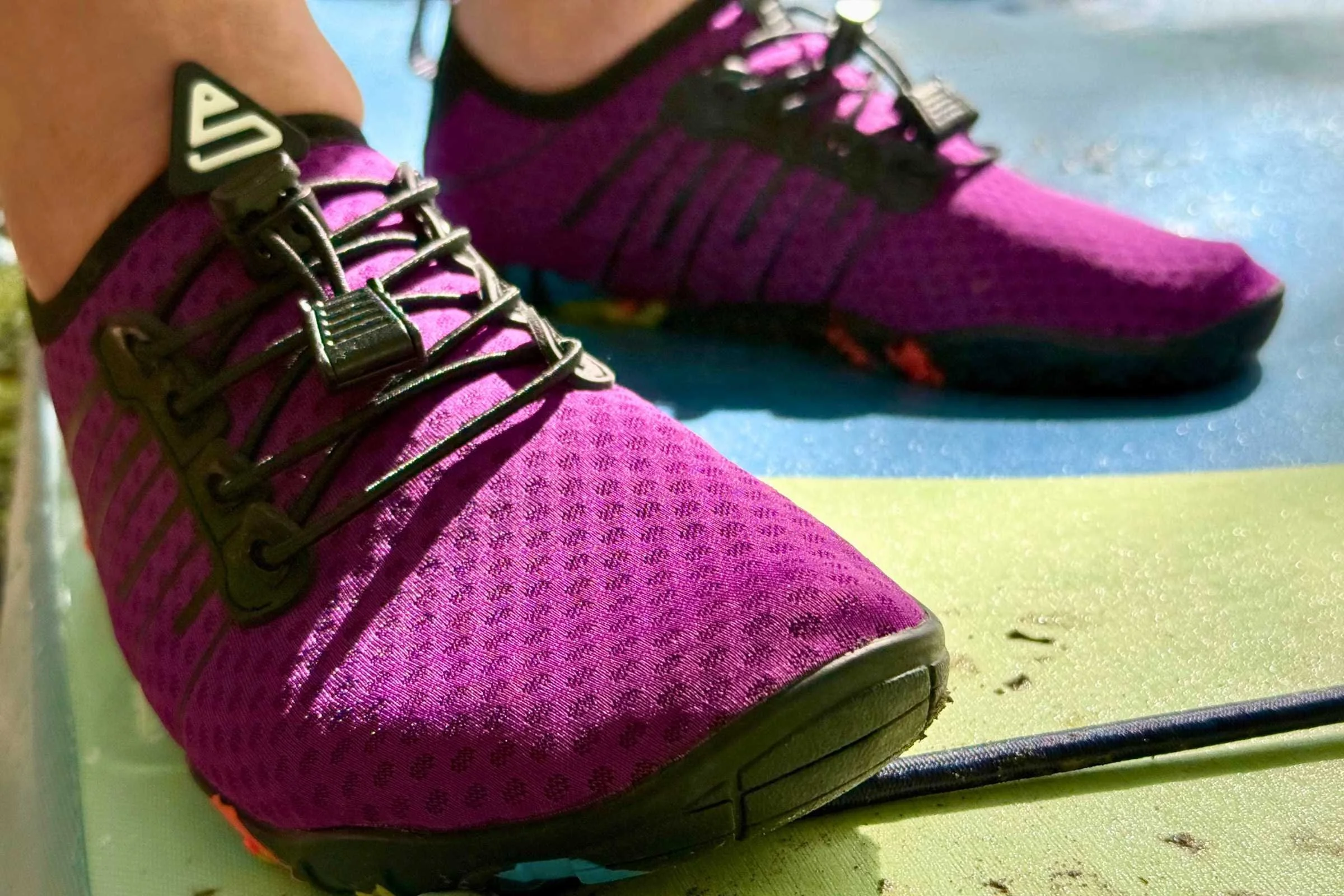 the purple mesh upper and bungee lacing of the simari water shoes