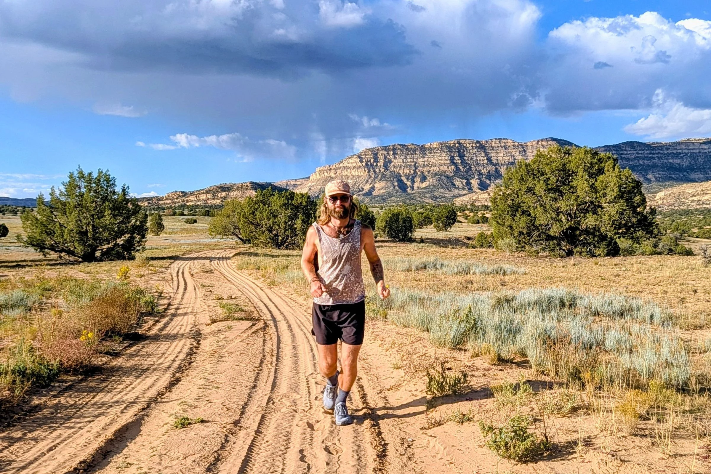 Man running in Brooks Ghost trail running shoes.