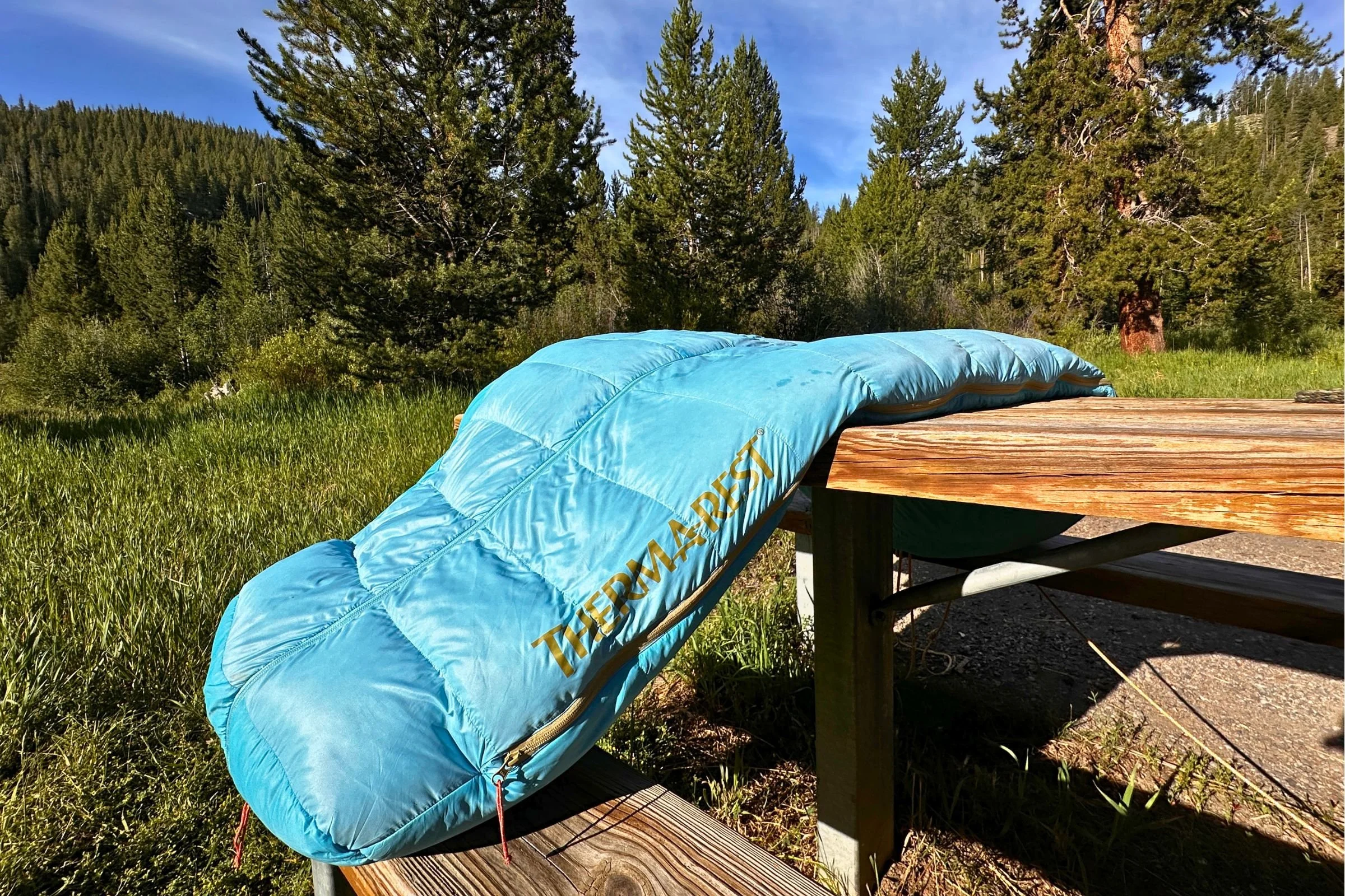 Therm-a-Rest Boost 650 drying on a picnic table.
