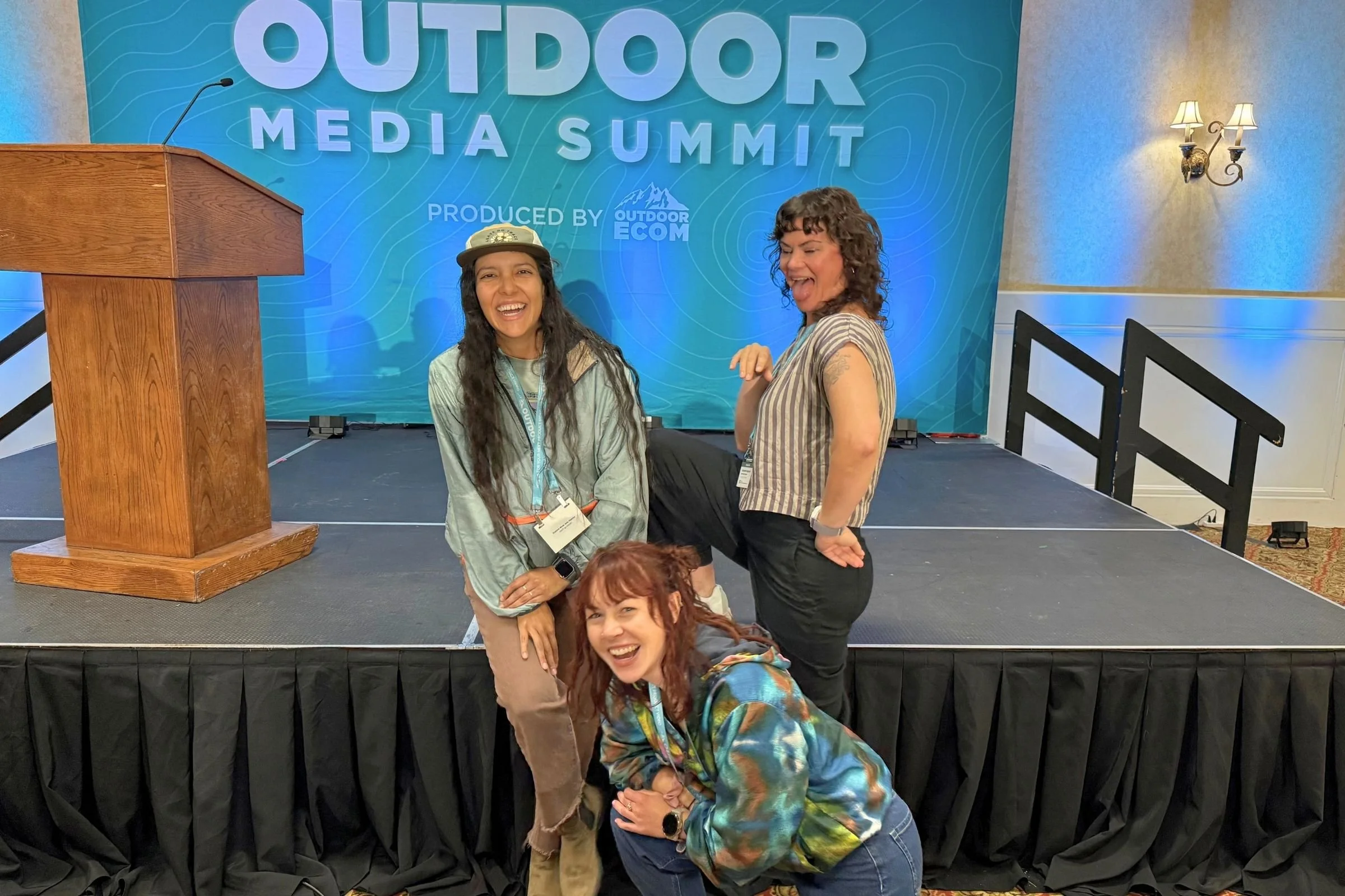 Women in front of the OMS stage.
