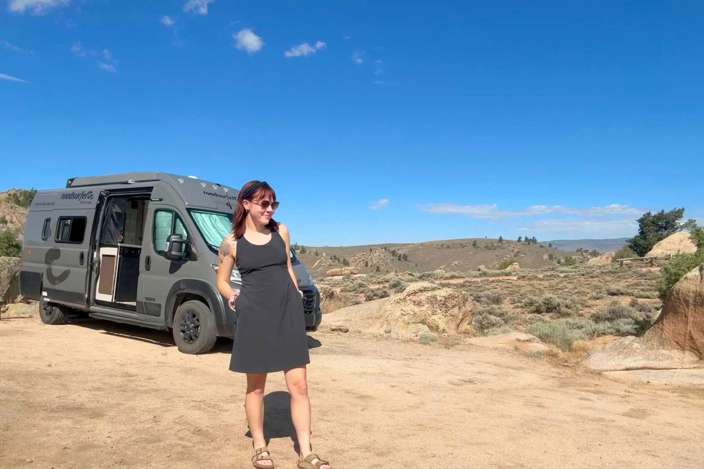 Woman wearing a Spotless Evolution dress at a campsite