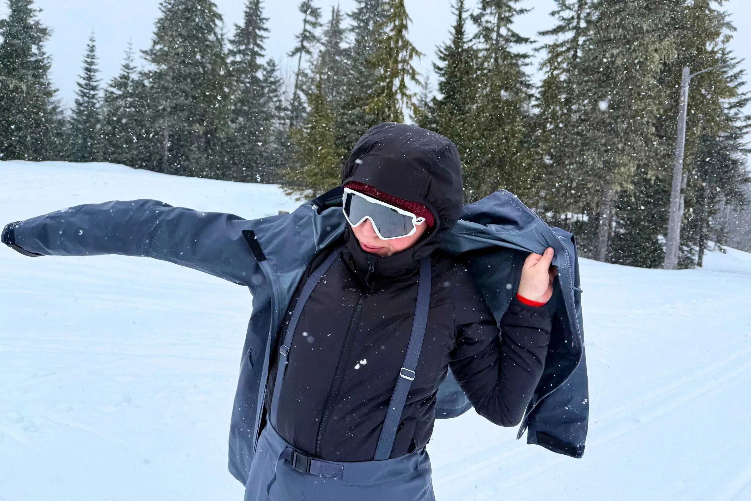 the author testing the Ibex Wool Aire Hoodie during a day of cross country skiing.