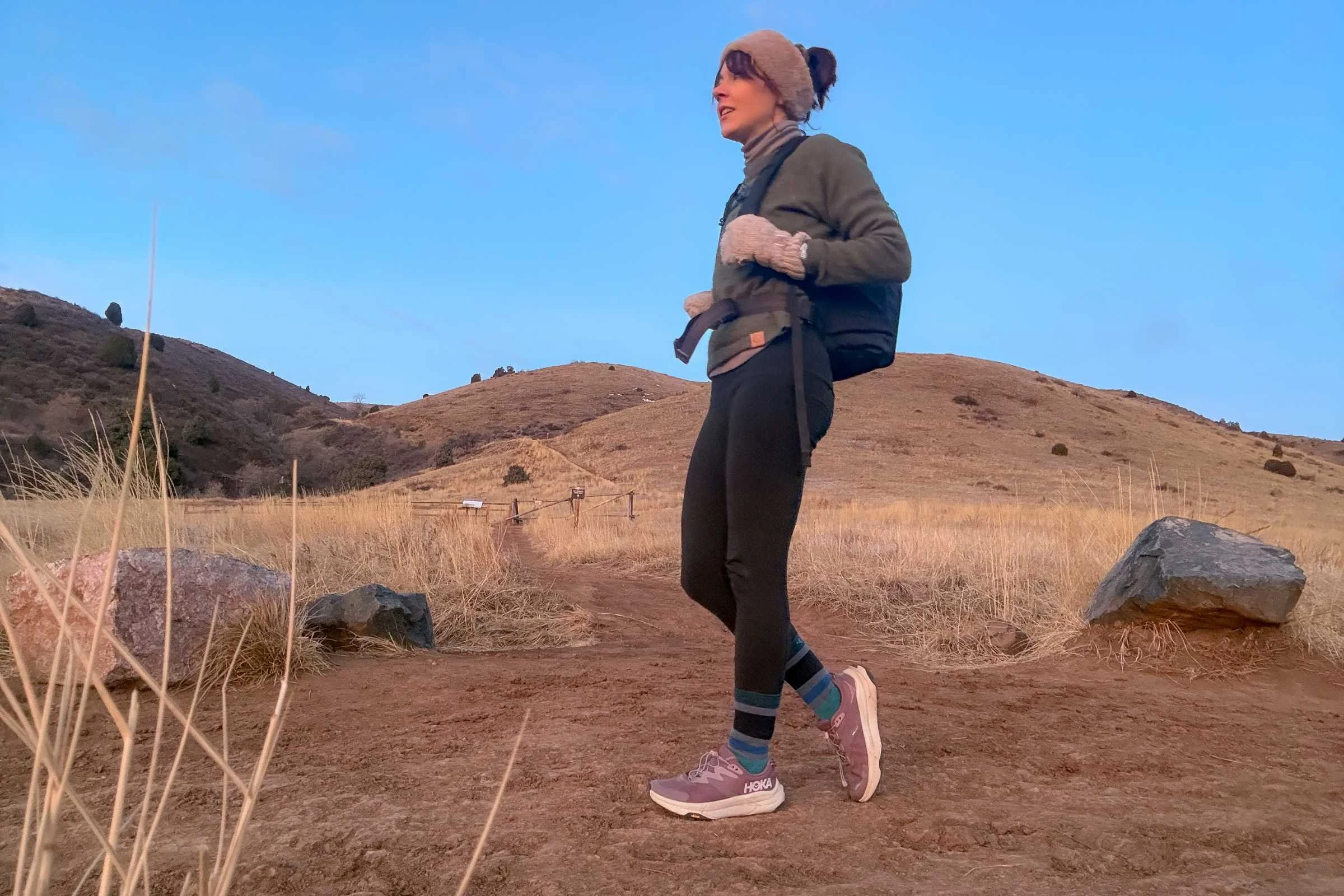 Side view of HOKA Transport 2 during hike on a dirt path